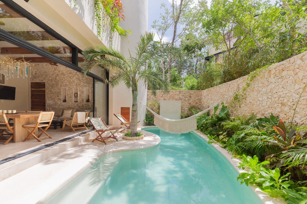 Private pool with hammocks and seating area, directly accessible from your living room.