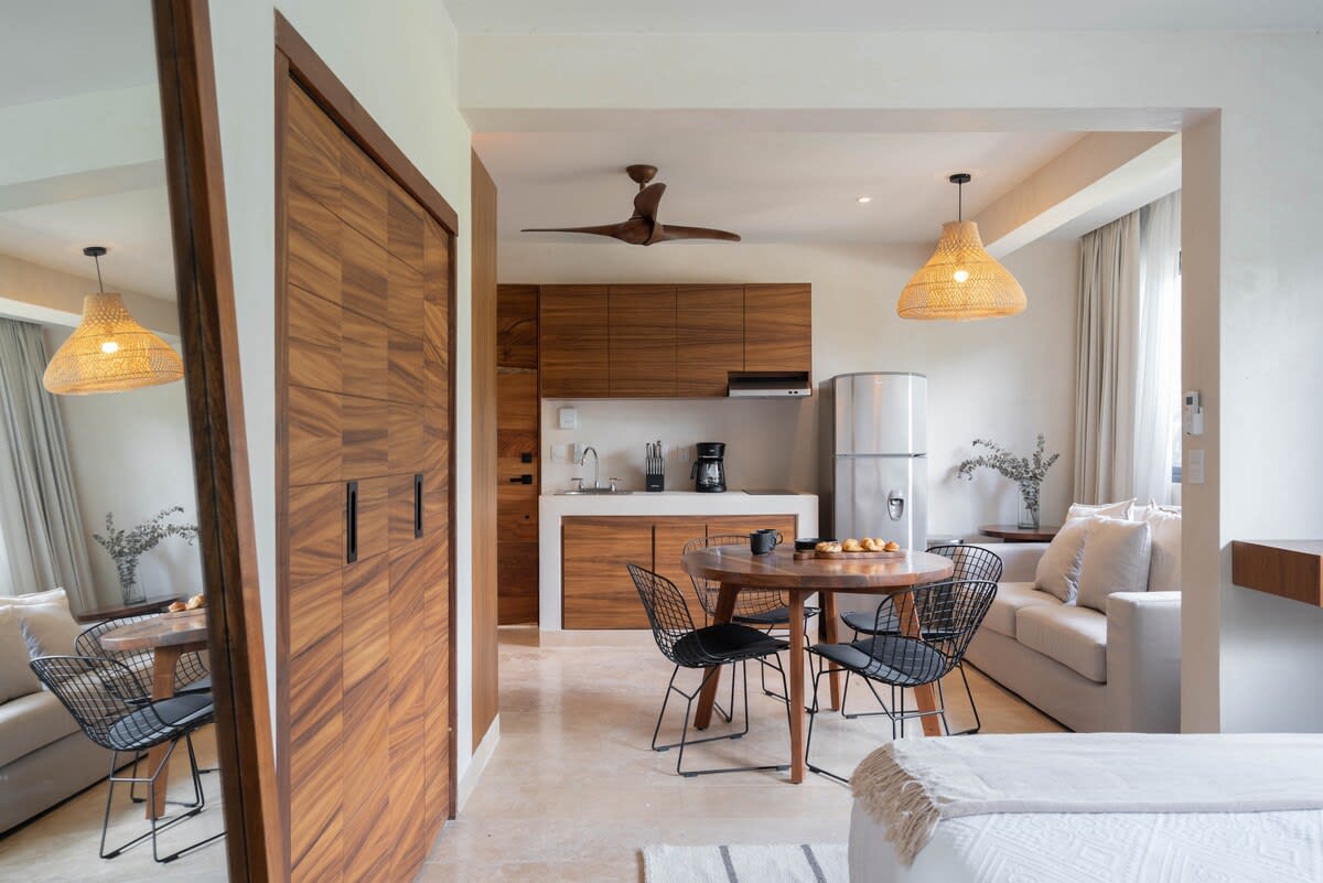 Bedroom with kitchen and dining area.