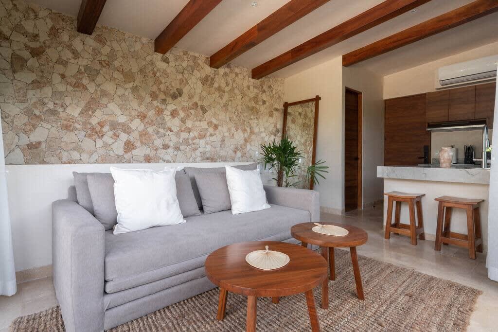Living room with kitchen and access to rooftop terrace