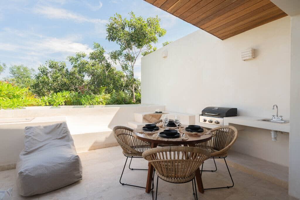 Rooftop terrace with plunge pool, grill and dining table. Direct access to living room.
