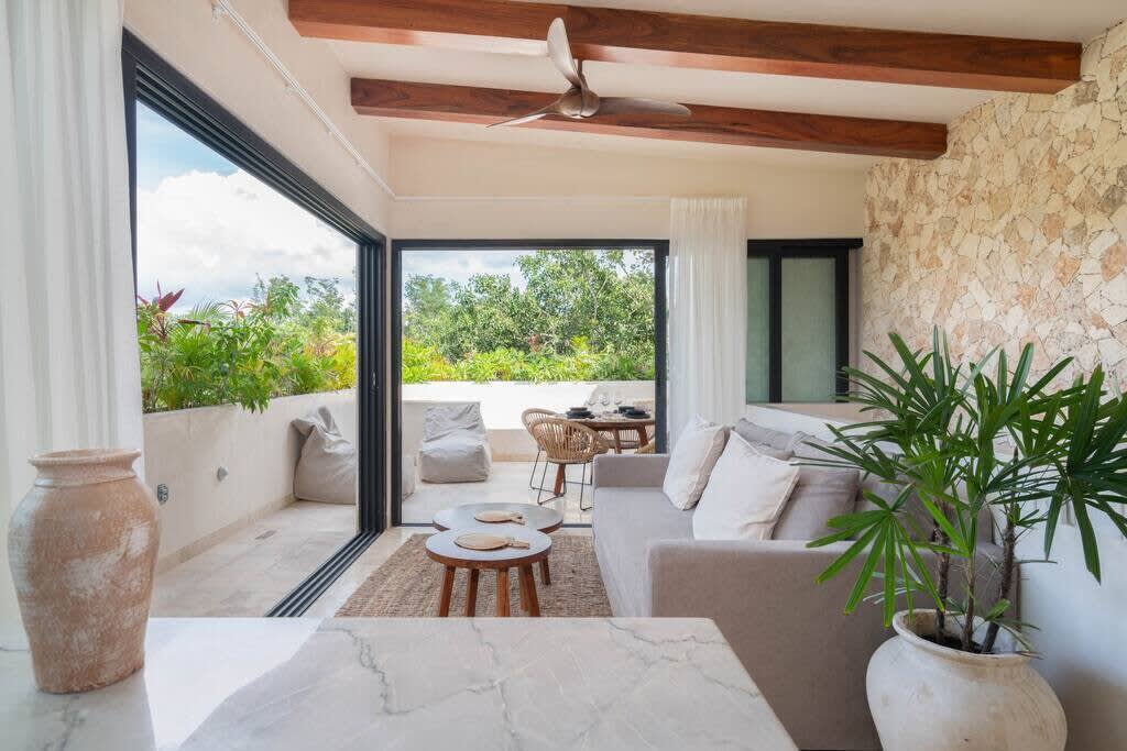 Living room with kitchen and access to rooftop terrace