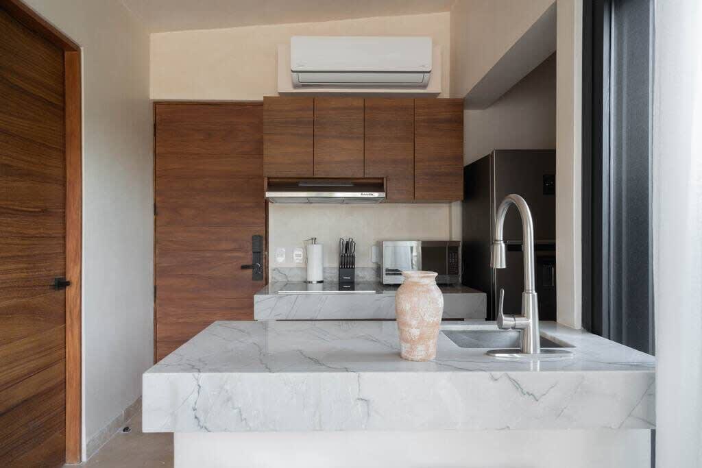Living room with kitchen and access to rooftop terrace