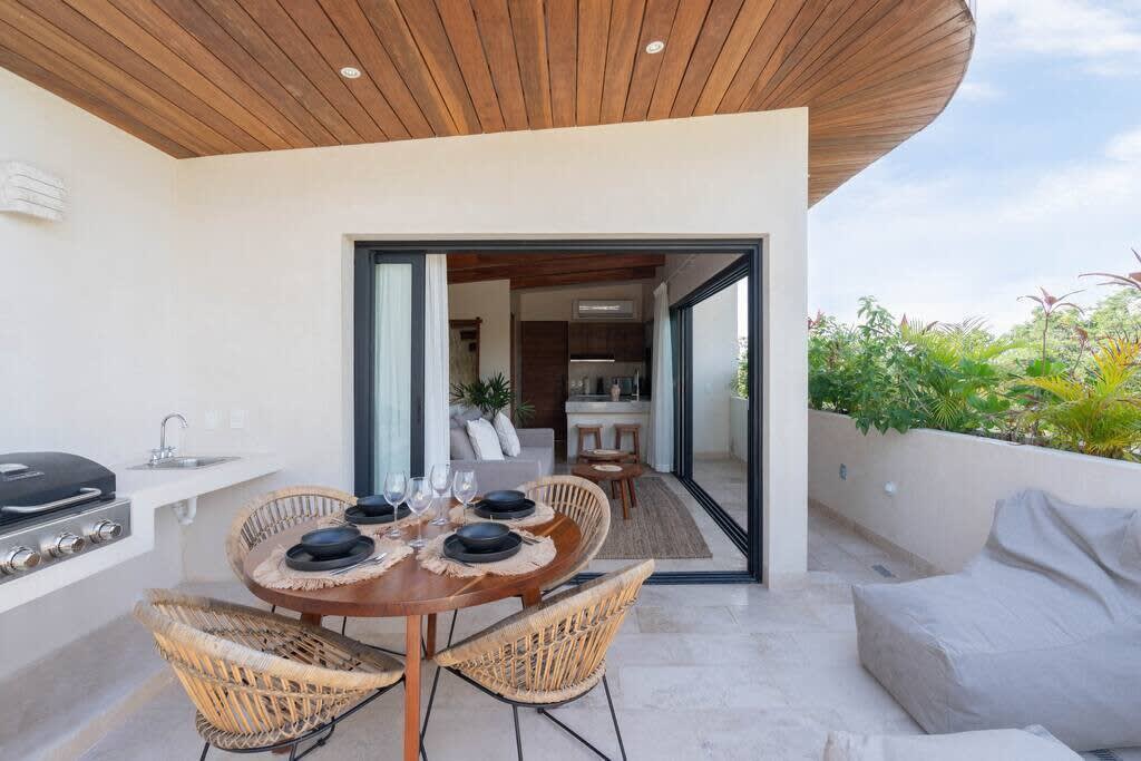 Rooftop terrace with plunge pool, grill and dining table. Direct access to living room.