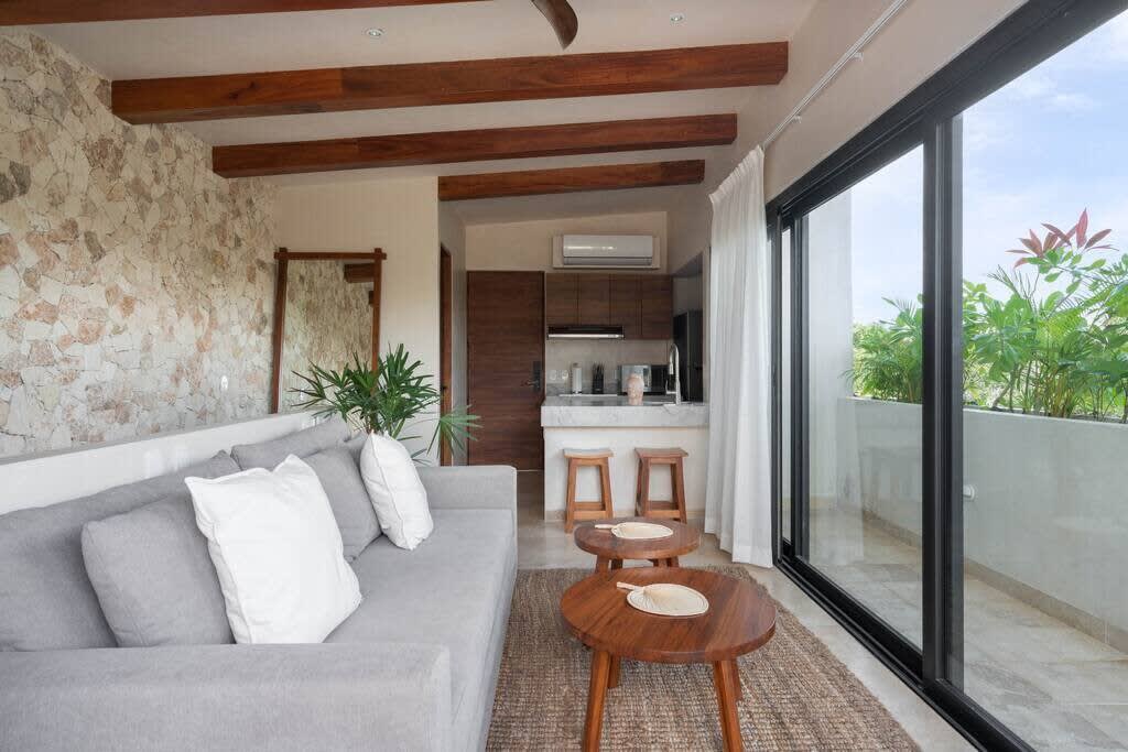 Living room with kitchen and access to rooftop terrace