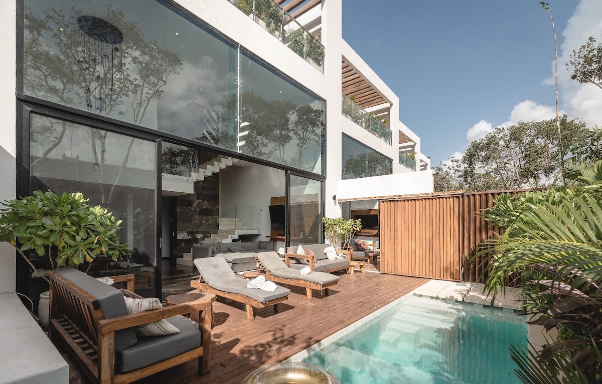 The two magnificent homes are connected by a pool area, allowing guests easy access between them.