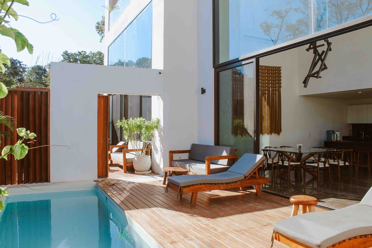 The two magnificent homes are connected by a pool area, allowing guests easy access between them.