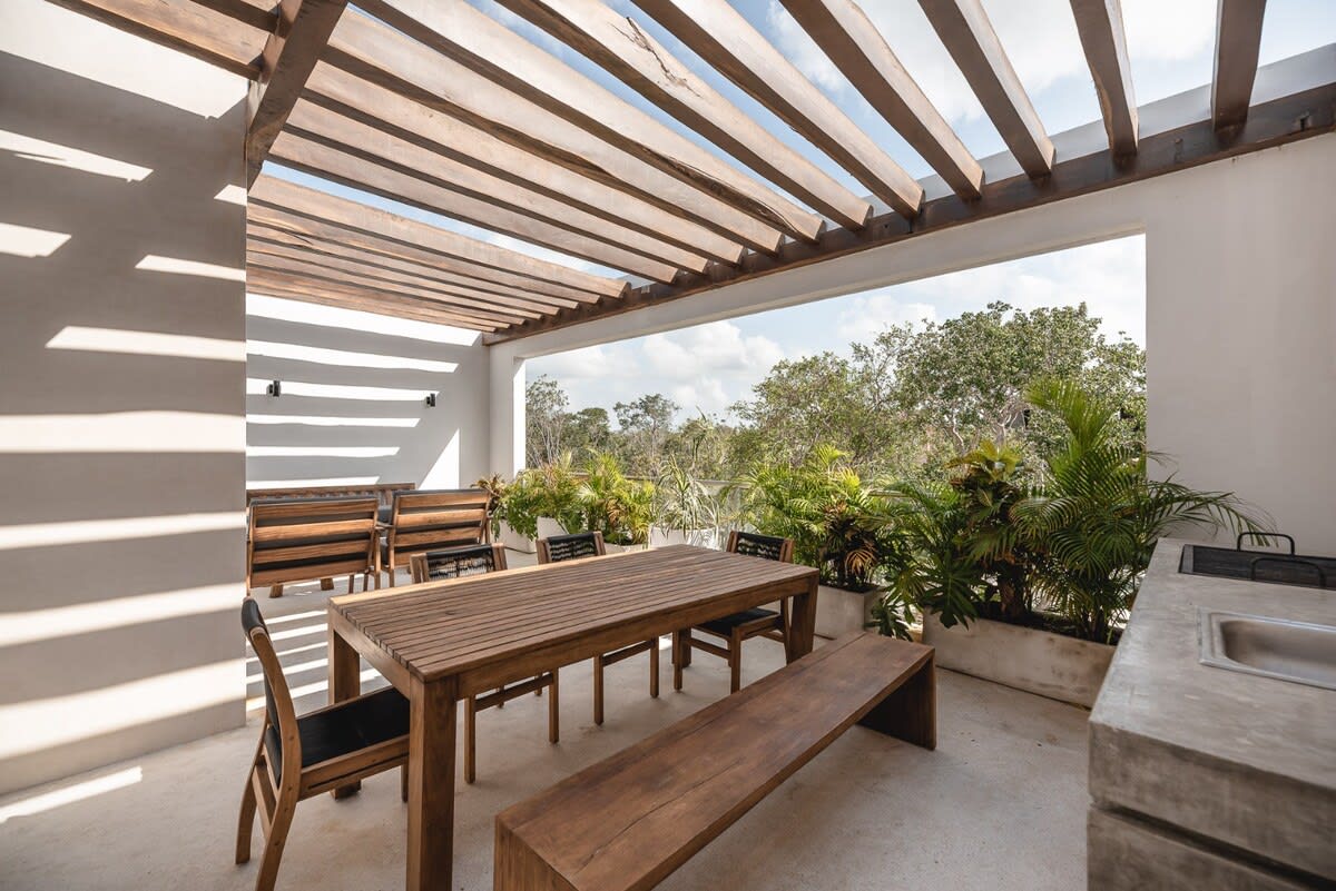 Terrace with a plunge pool and outdoor dining area.