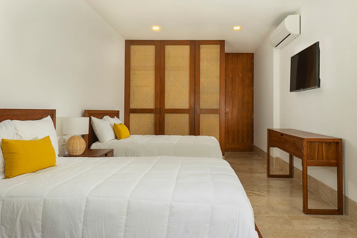 Bedroom #2 (2 double beds)  / fan, air conditioner, tv