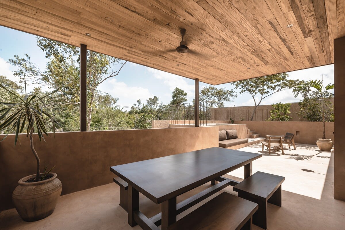 Rooftop dining area, with grill, mini fridge, half bathroom and outdoor shower