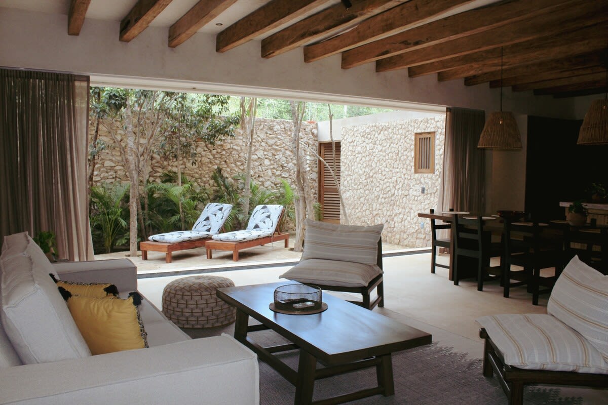 Floor-to-ceiling windows looking out to the private garden