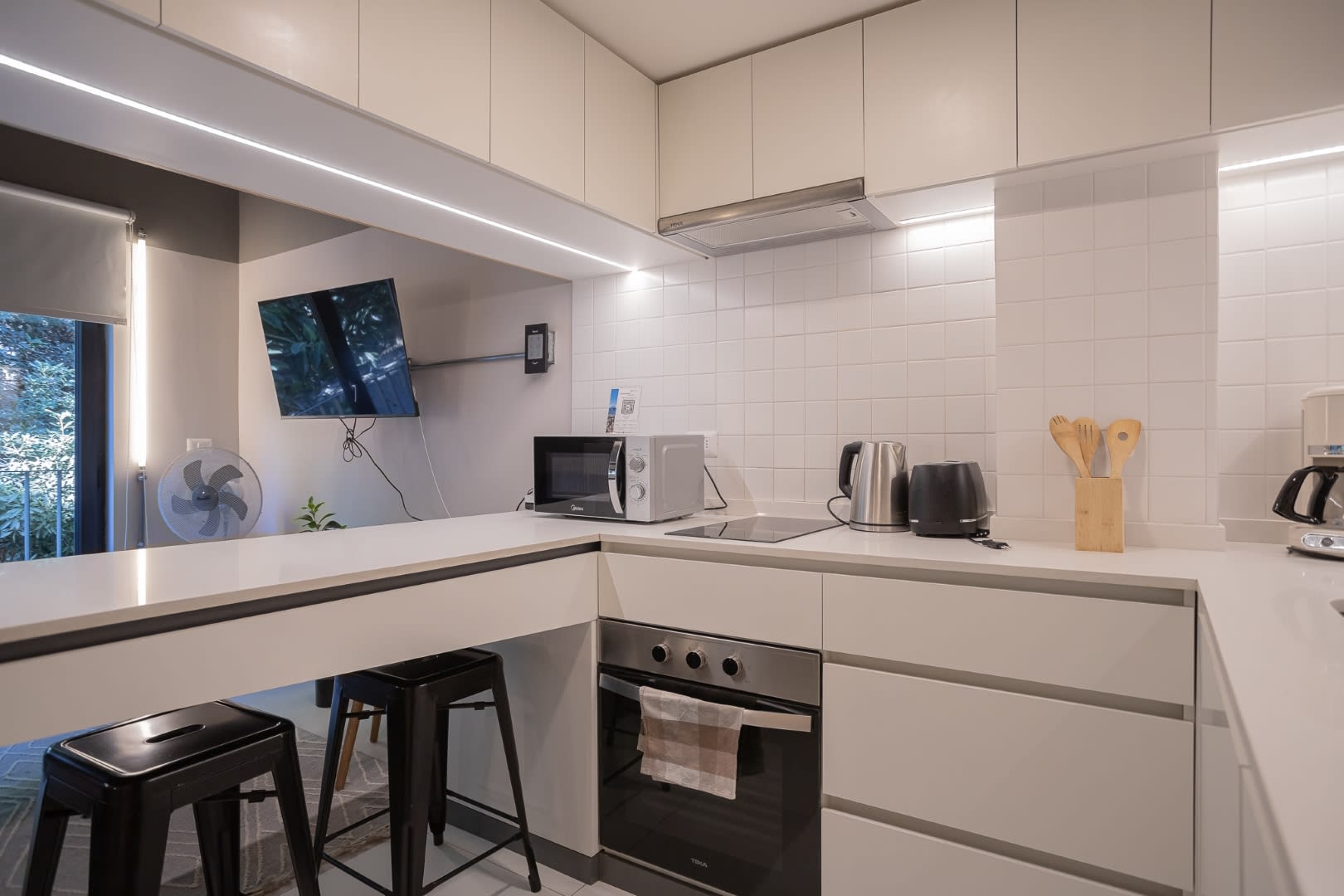 Sleek and modern kitchen with all essentials, perfect for cooking and entertaining in style.