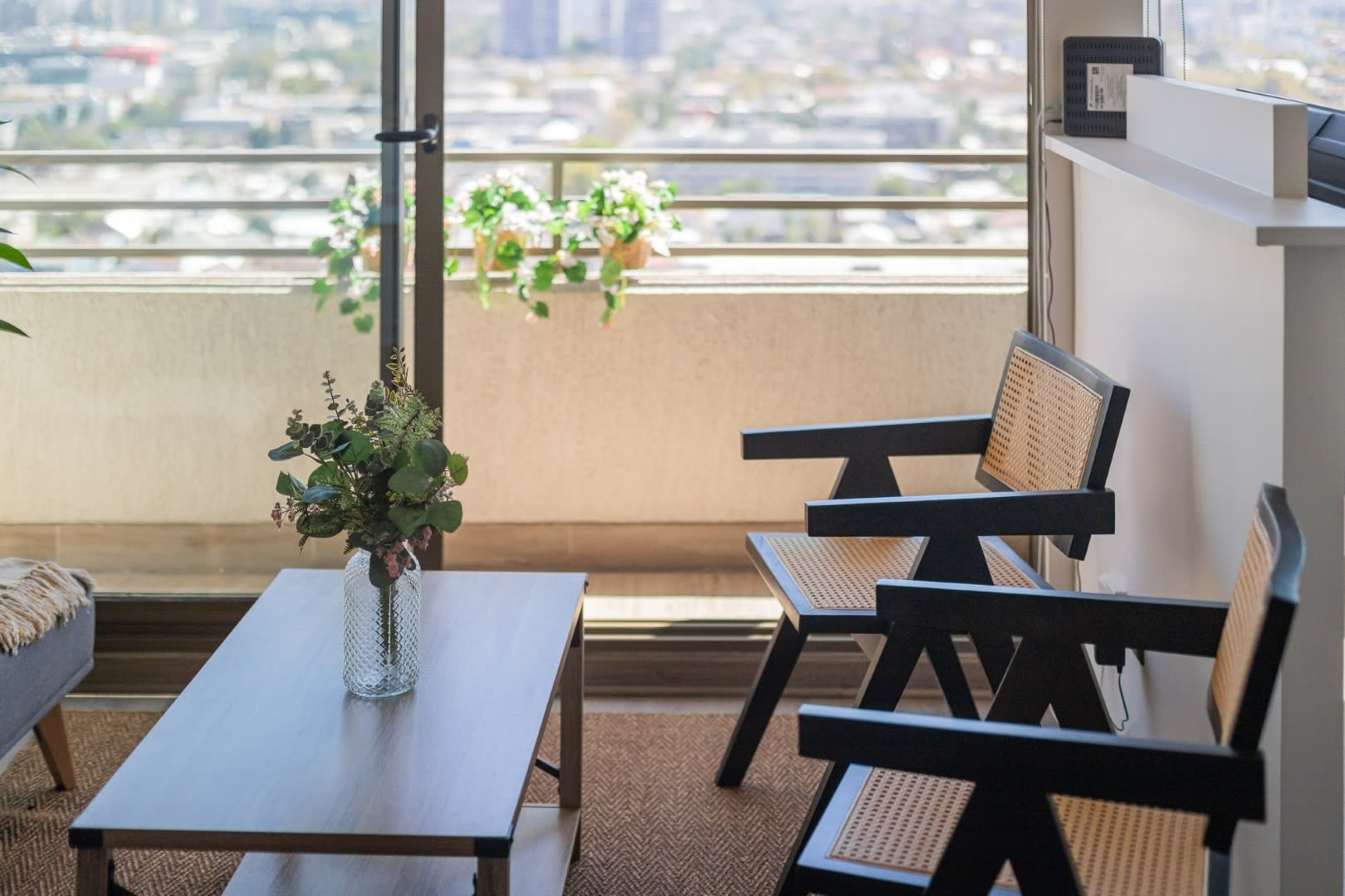 Bright and airy living space with stunning city views, perfect for relaxation.