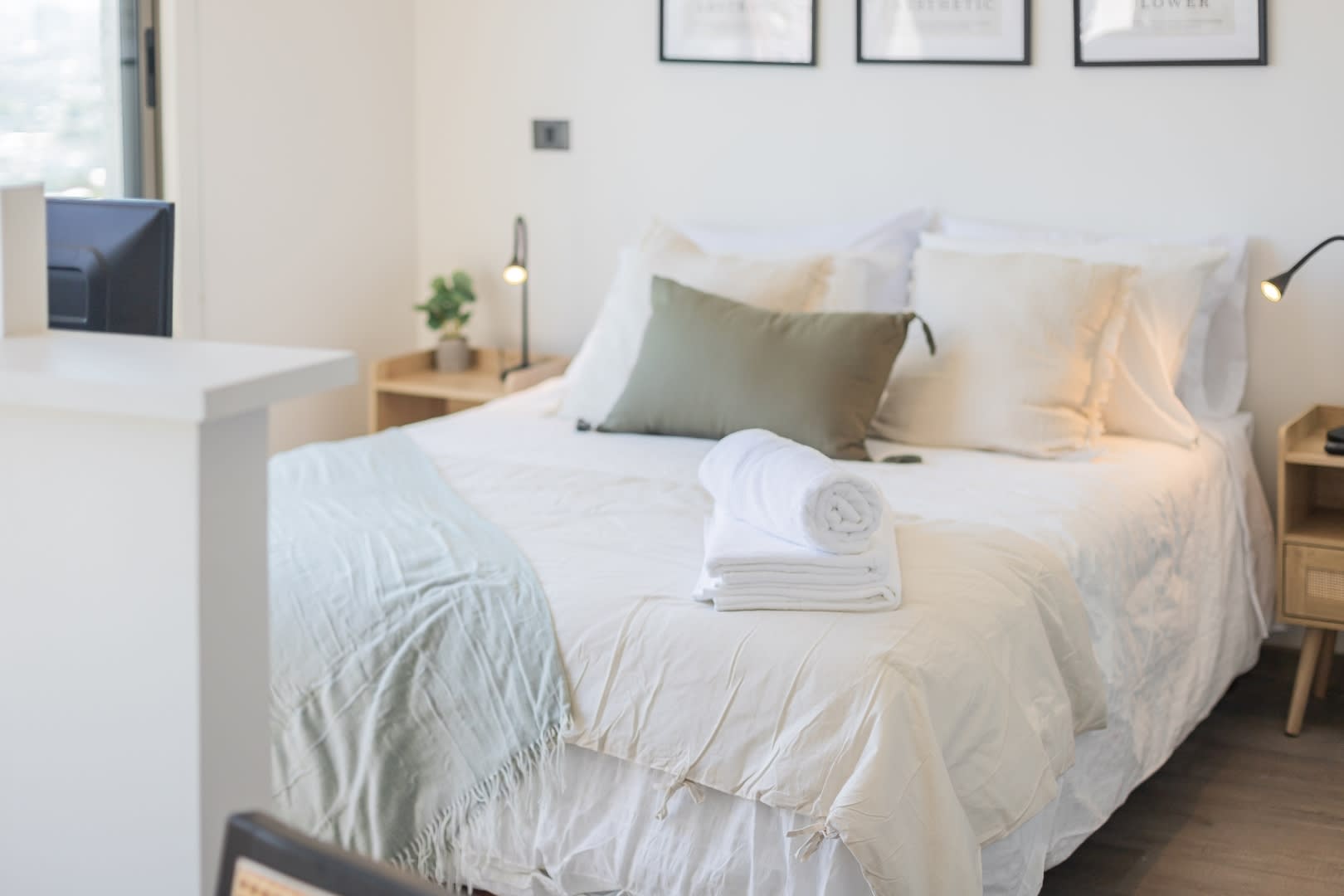 Relax in this cozy bedroom with soft linens and natural light, perfect for a restful stay.