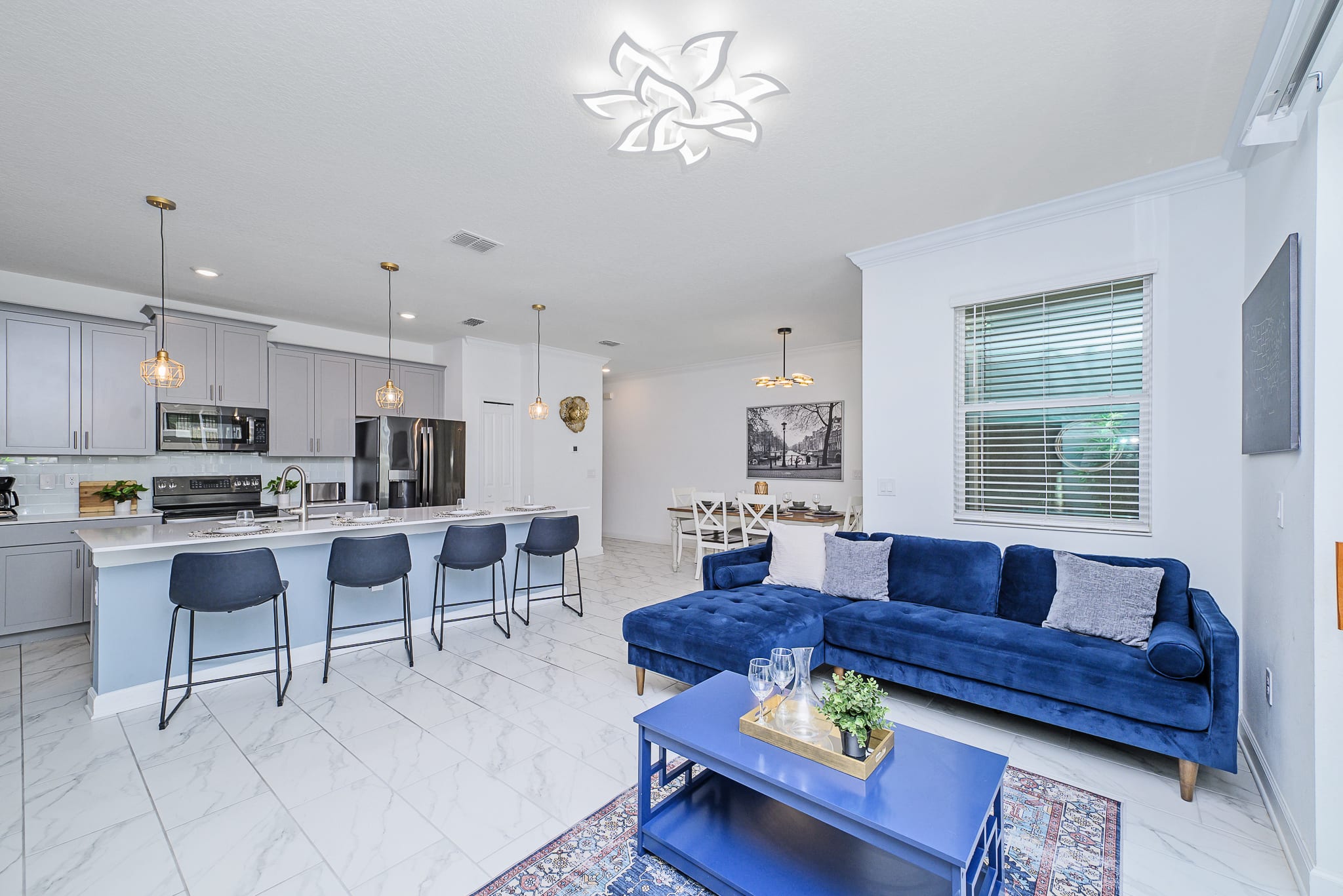 Bright And Spacious Living Room With Modern Decor And Dining Area
