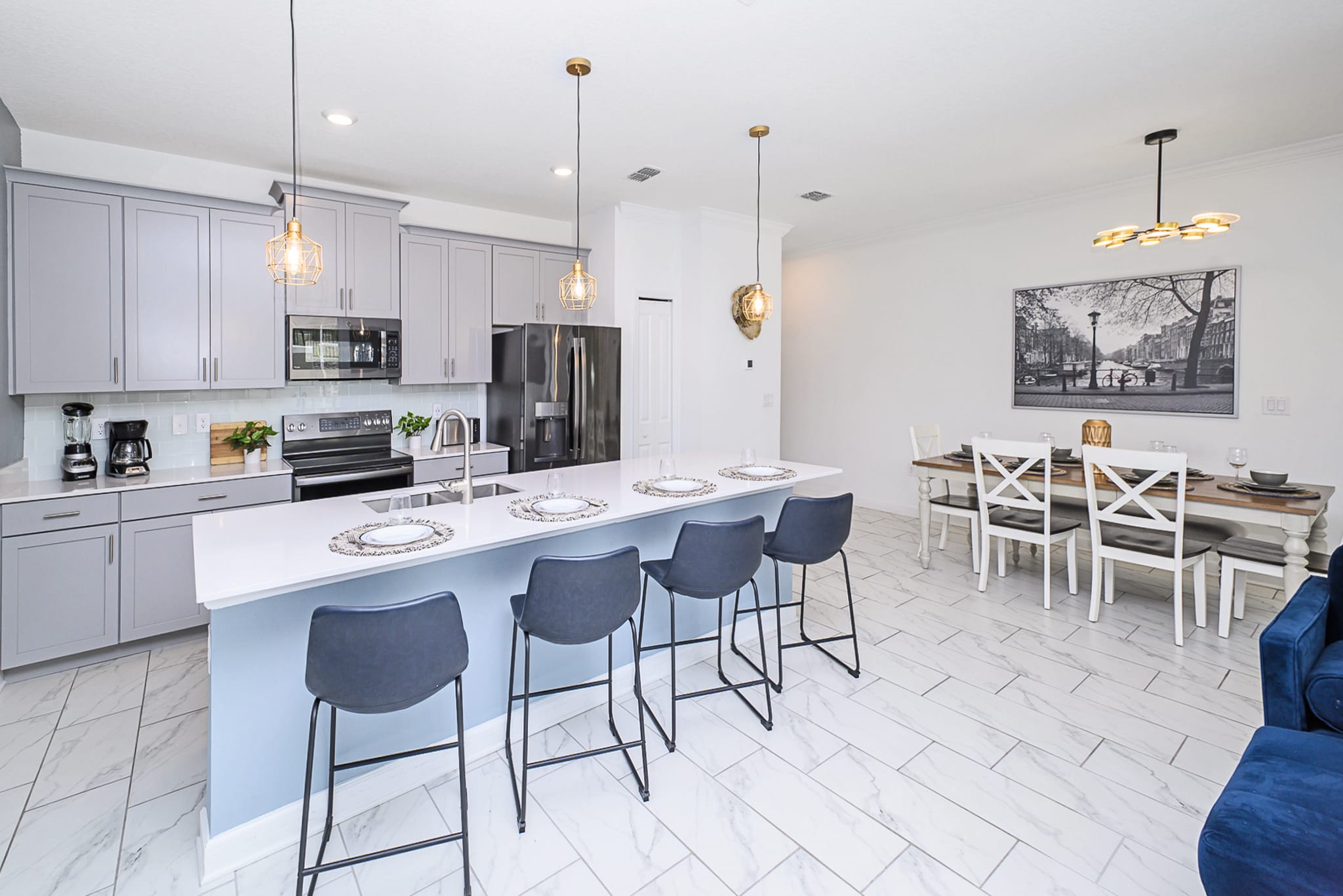 Fully Equipped Kitchen With High-End Appliances And Island Seating