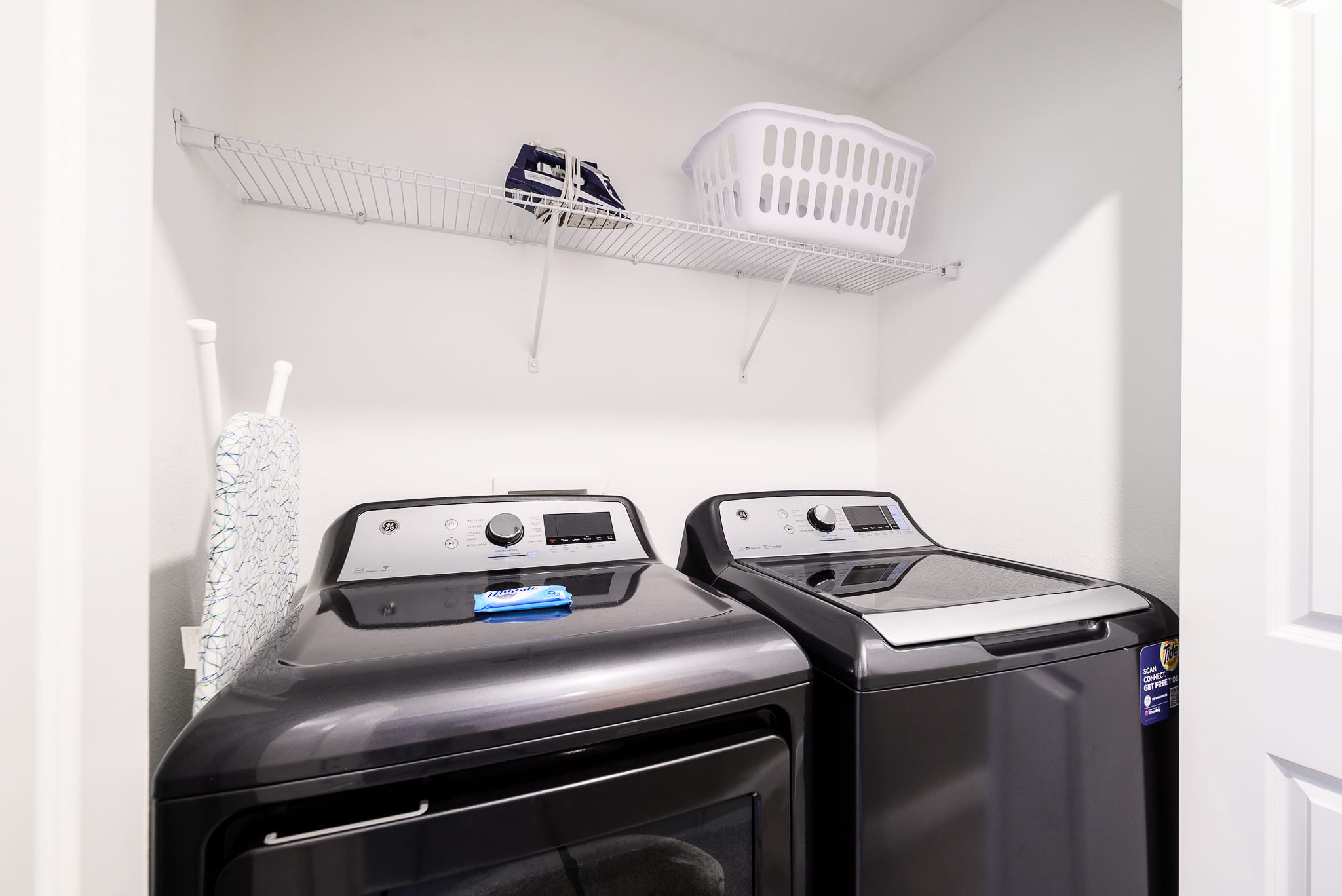 Functional Laundry Room With Modern Washer And Dryer Units
