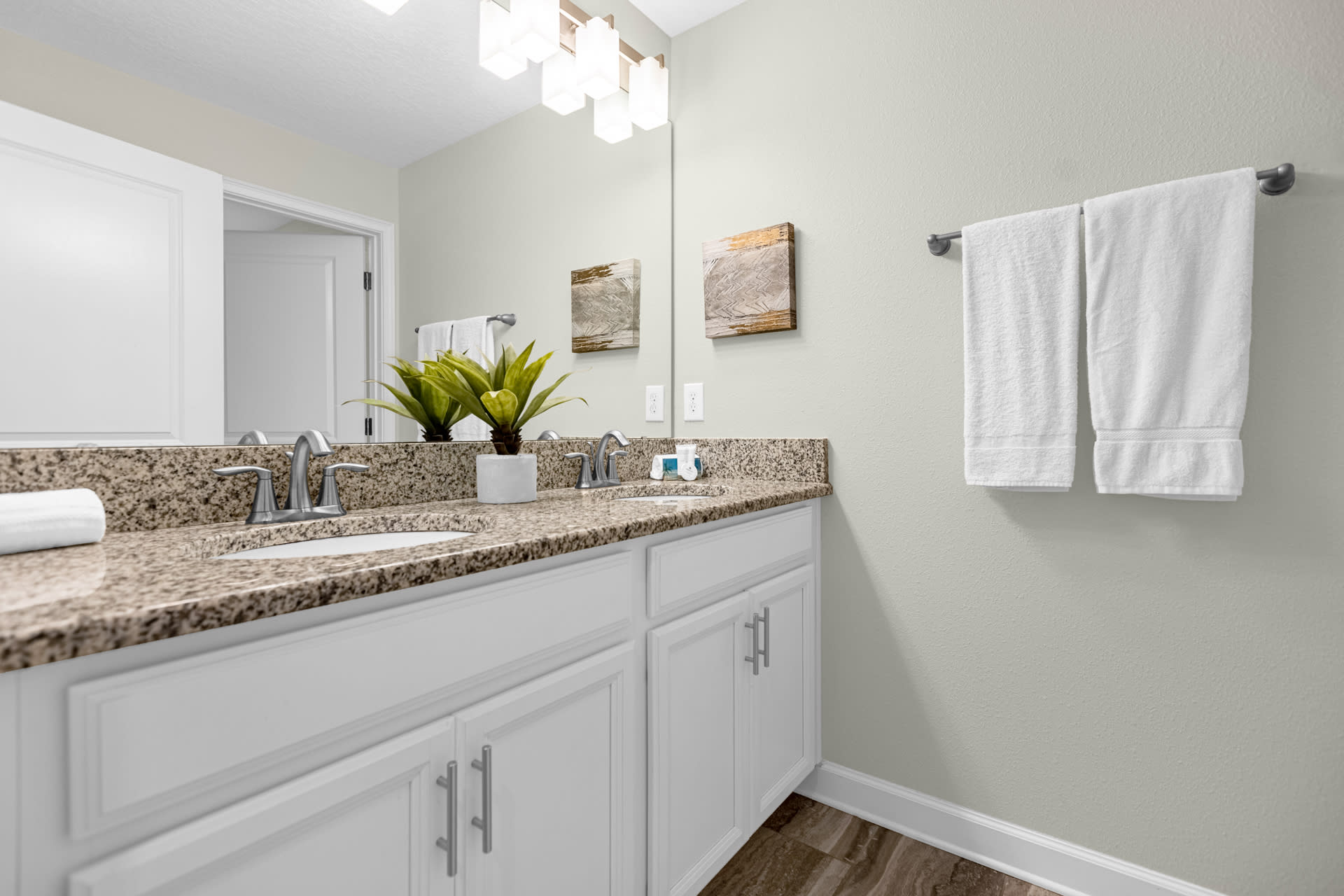 Bright Bathroom Featuring A Double Vanity And Modern Decor