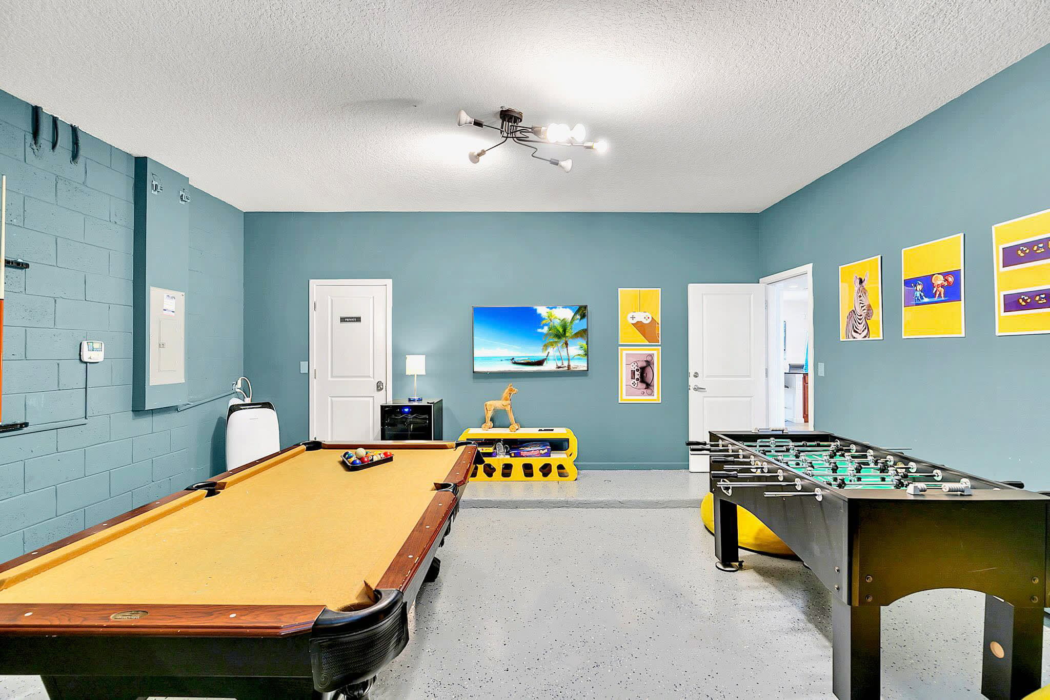 Spacious Game Room With Board Games And Arcade Setup