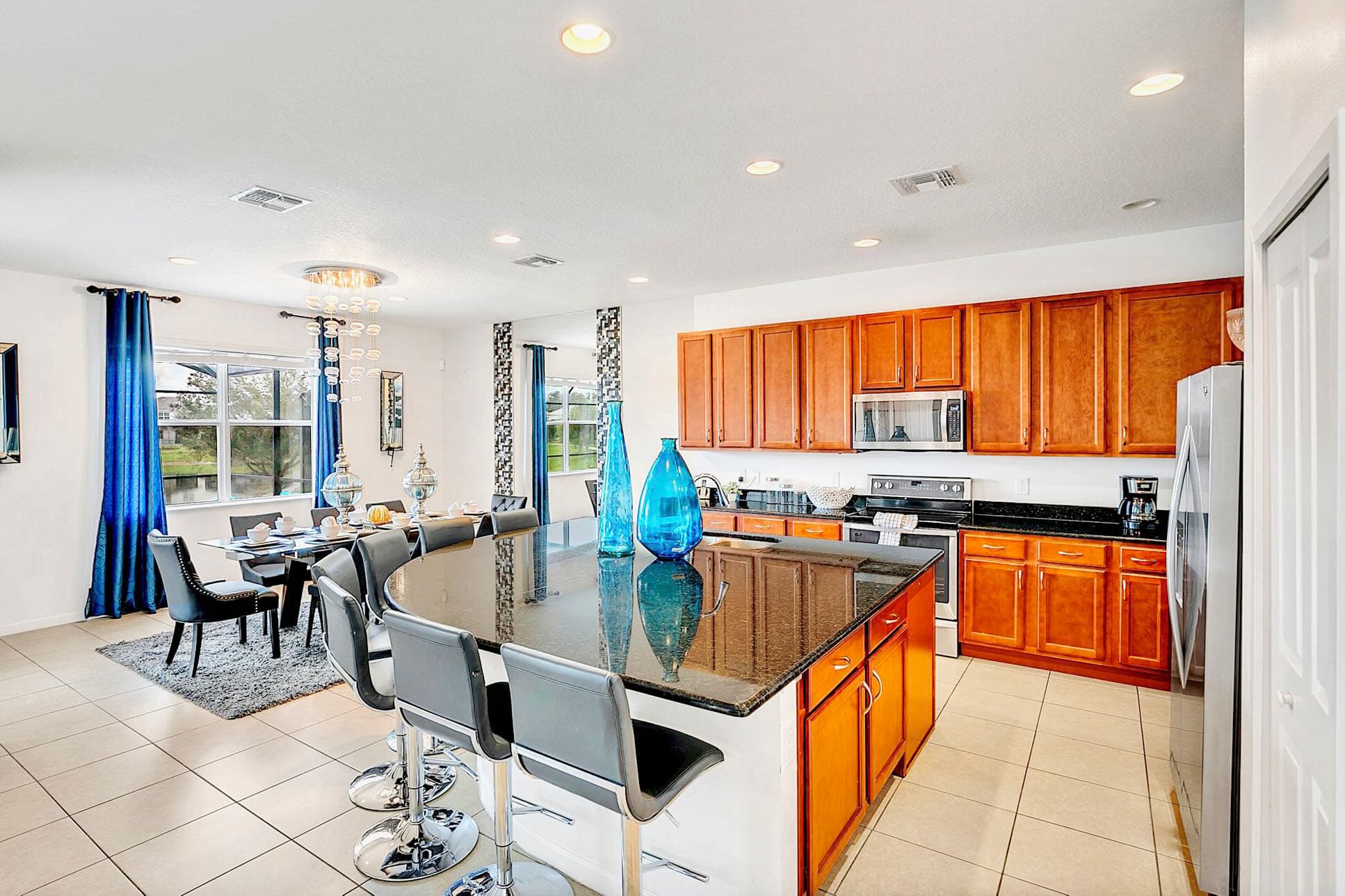Open-Plan Dining Area Next To A Fully Equipped Kitchen
