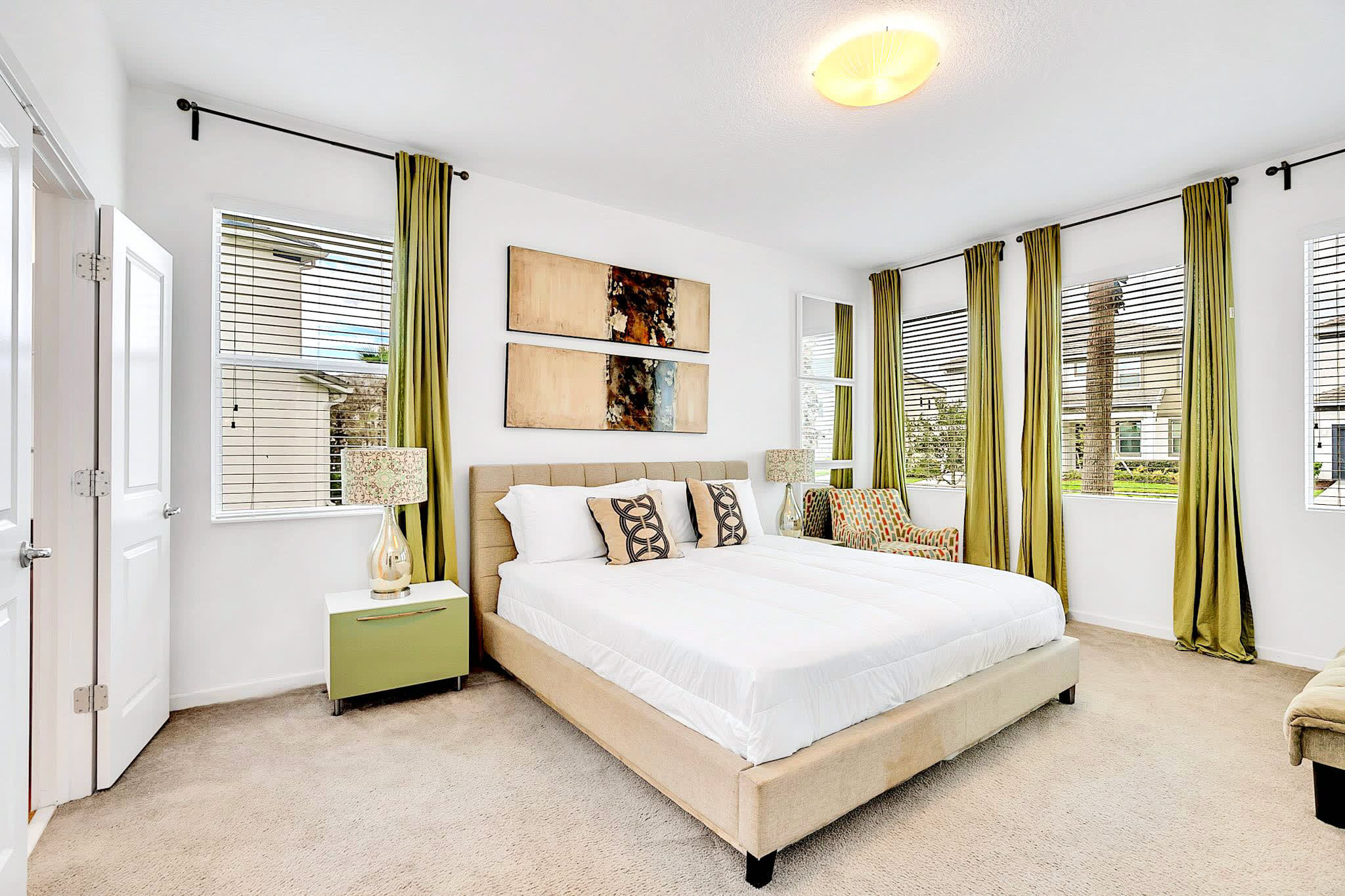 Serene Master Bedroom With Luxurious King Bed And Natural Light