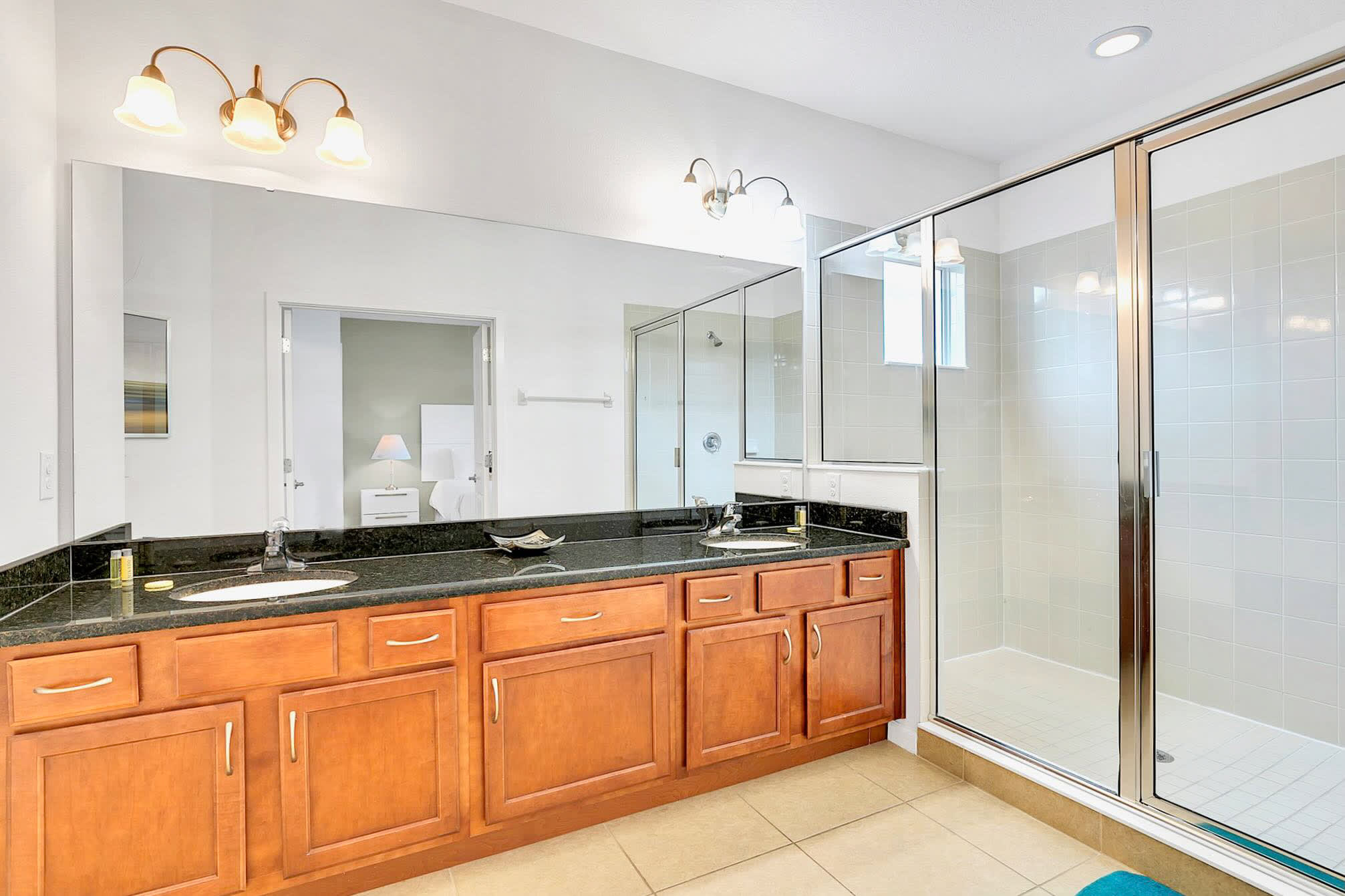 Luxurious Bathroom With Dual Sinks And A Walk-In Shower
