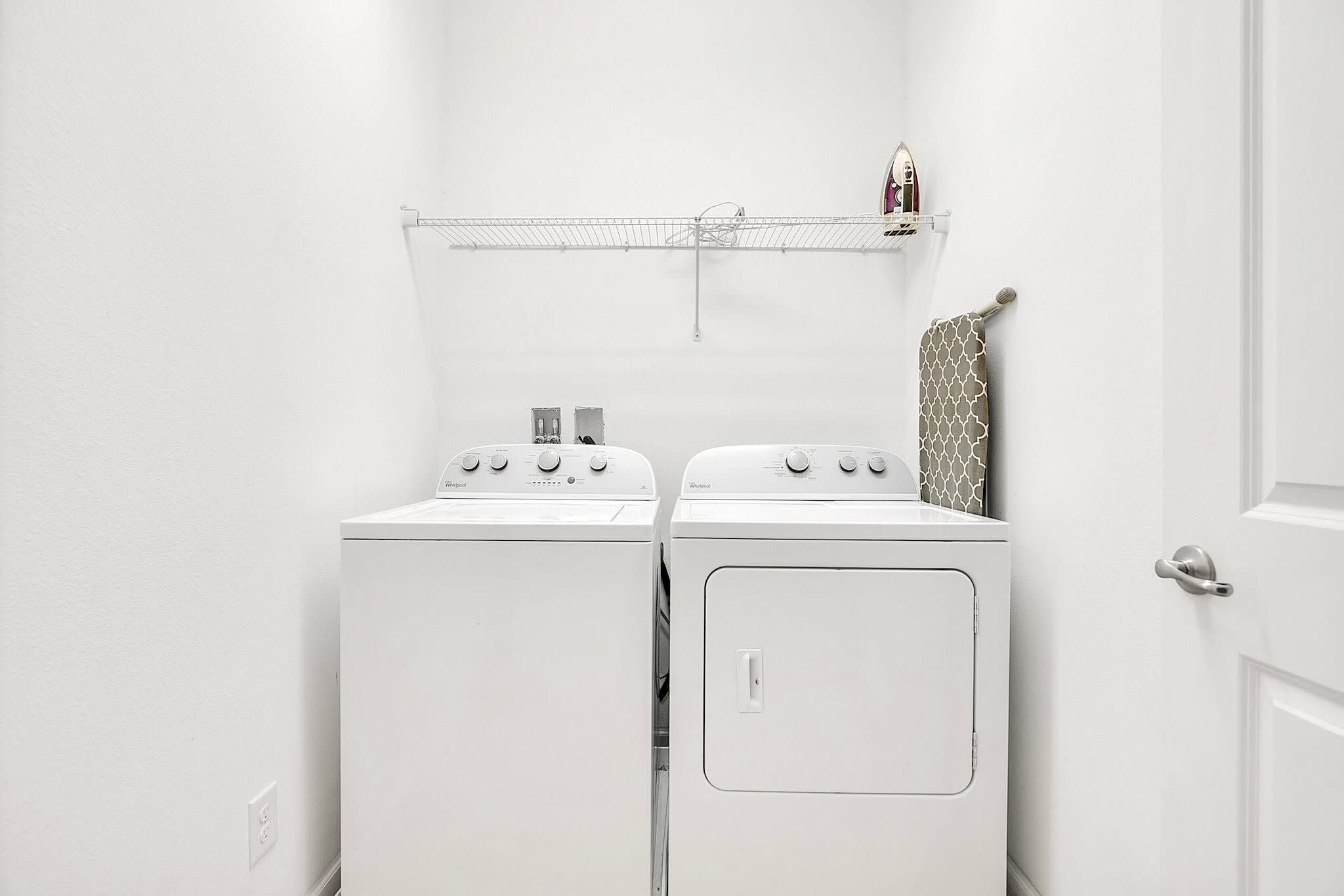 Convenient Laundry Room With Full Washer And Dryer Set