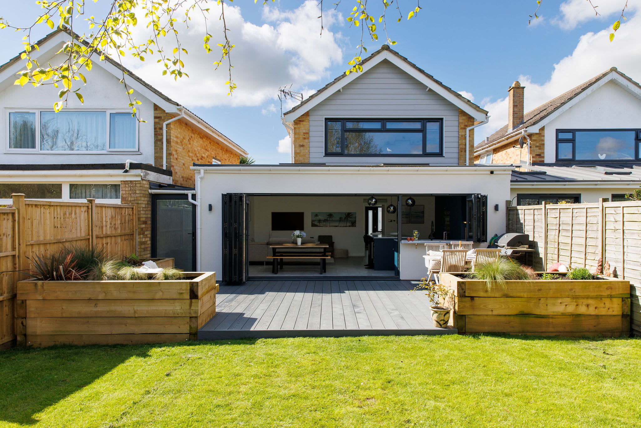 The garden has raised beds, a manicured lawn and a beautiful decked area for dining and relaxing.