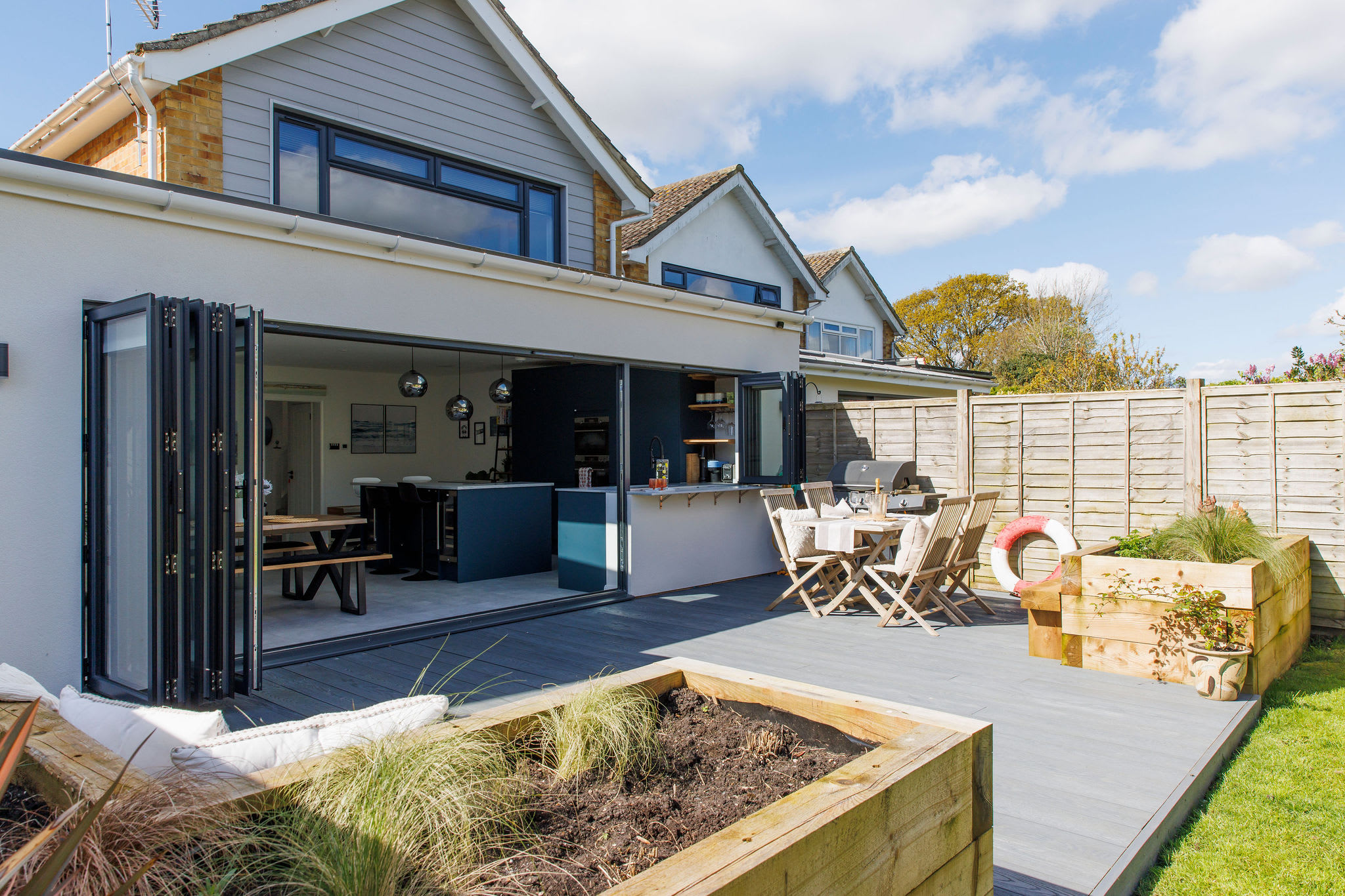 Step outside to the beautiful back garden with expansive decking, perfect for socialising & BBQs with loved ones.