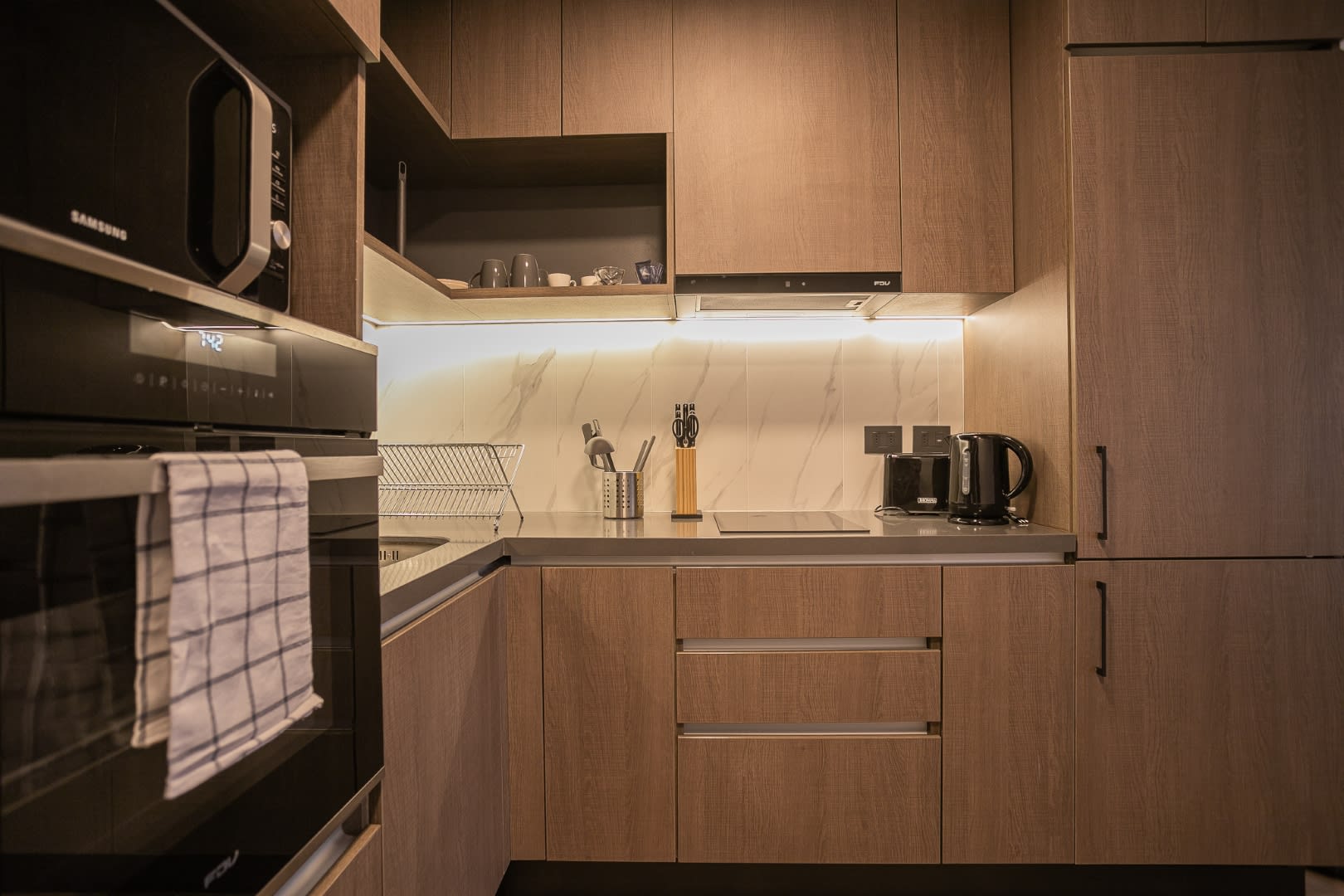 Sleek and modern kitchen with all essentials for a cozy stay in the heart of Chile. Perfect for cooking and enjoying meals at home.