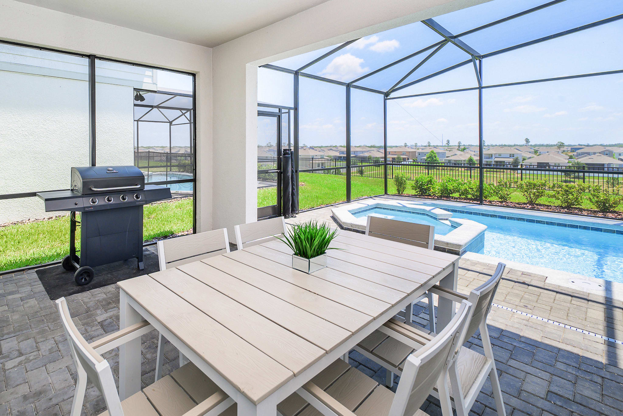 Outdoor dining area with BBQ grill