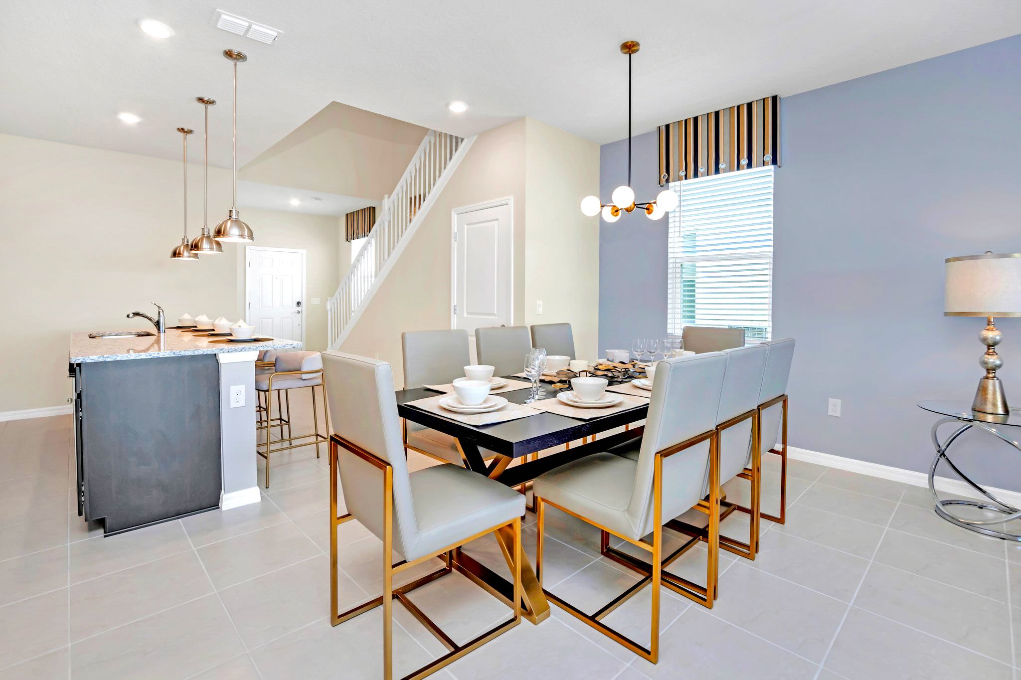 Open Dining Area Adjacent To Gourmet Kitchen And Staircase