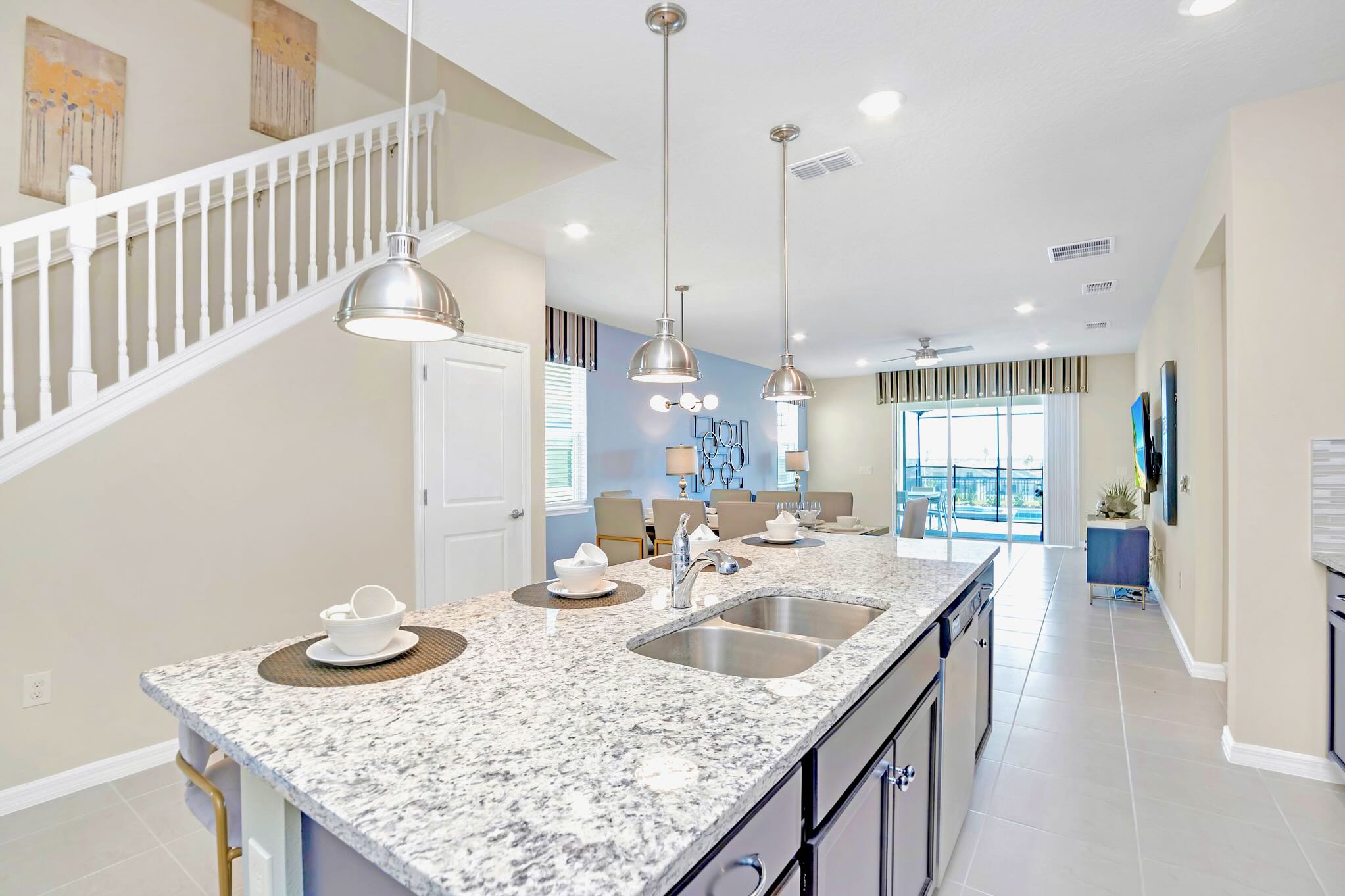 Spacious Kitchen With Granite Island And Seating For Four