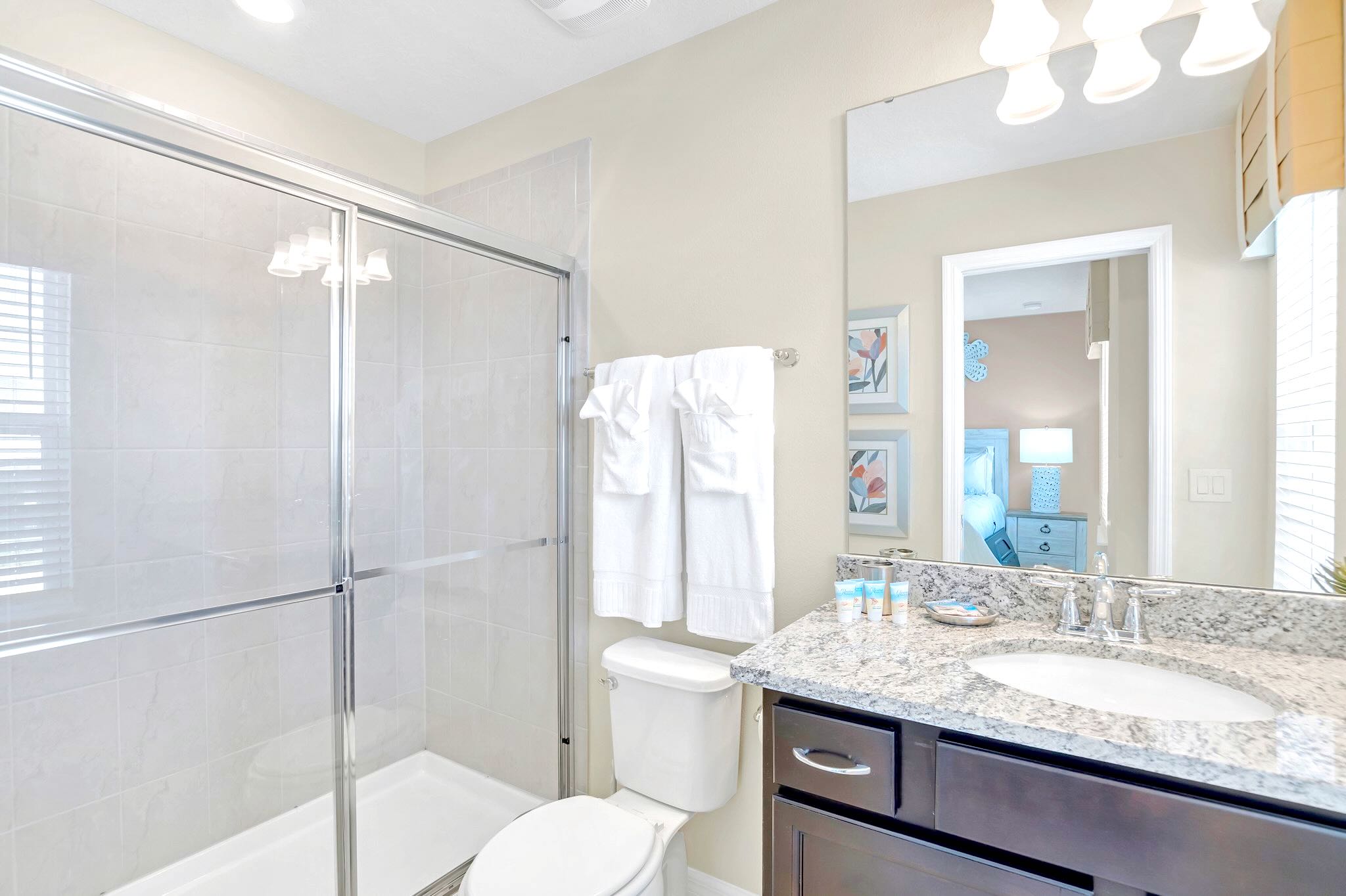 Modern Ensuite With Glass Shower And Polished Finishes