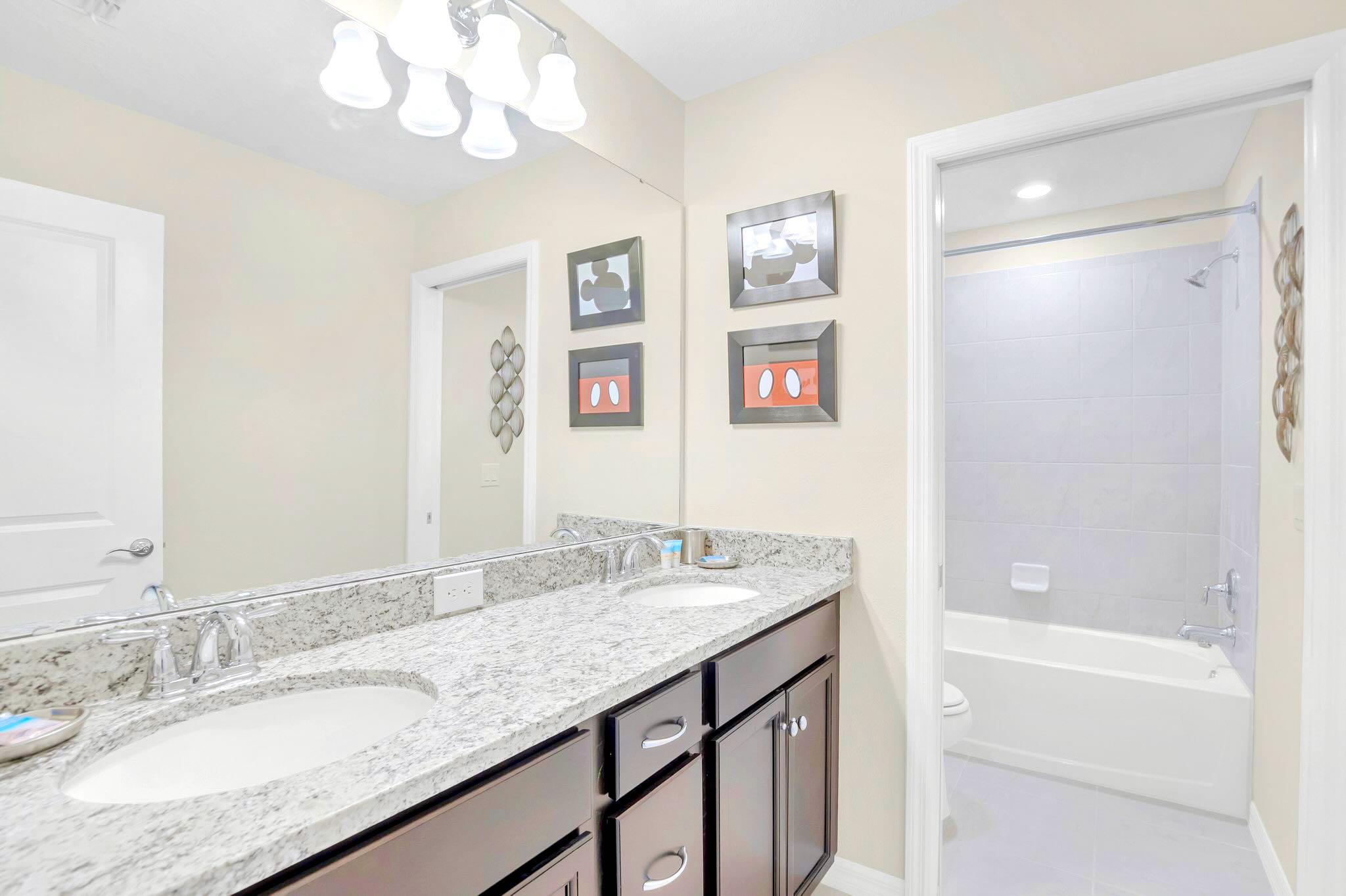 Modern Bathroom With Double Sinks And Bright Finishes