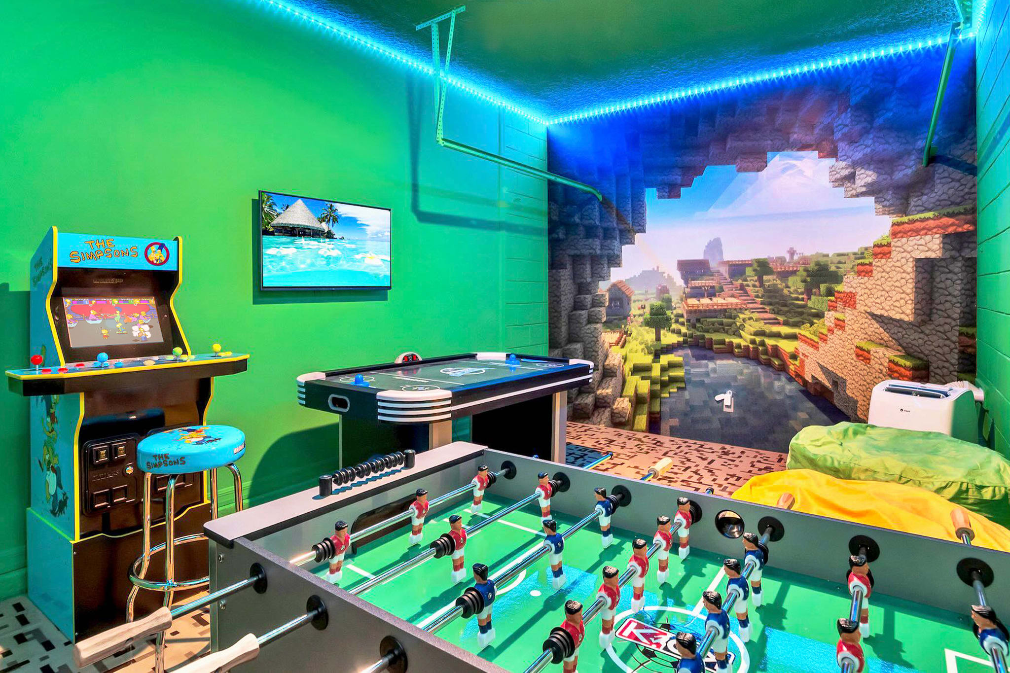 Minecraft themed games room with foosball, arcade game, air hockey and big screen TV