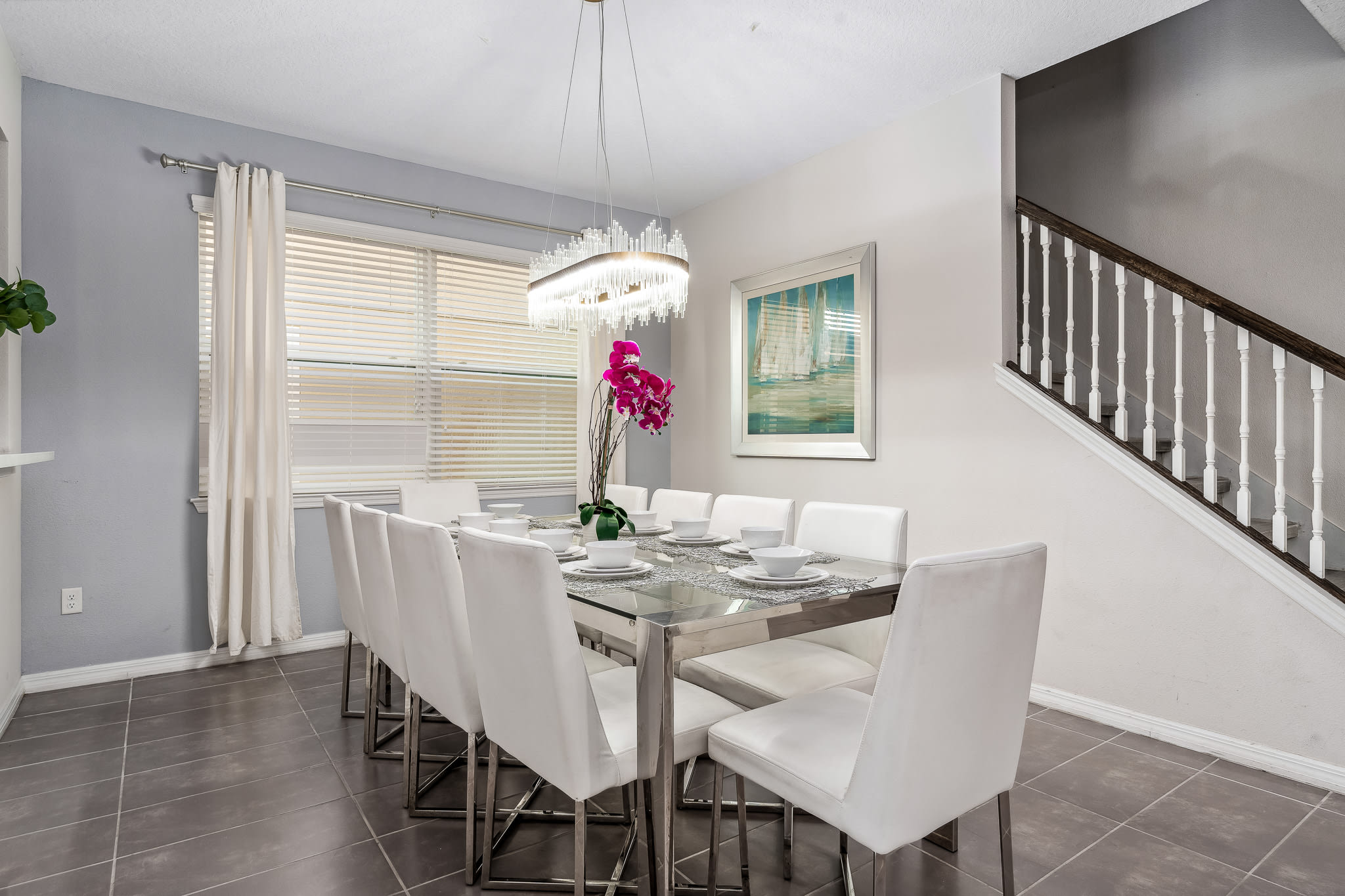 Bright dining nook w/ modern table set just off the main living space.