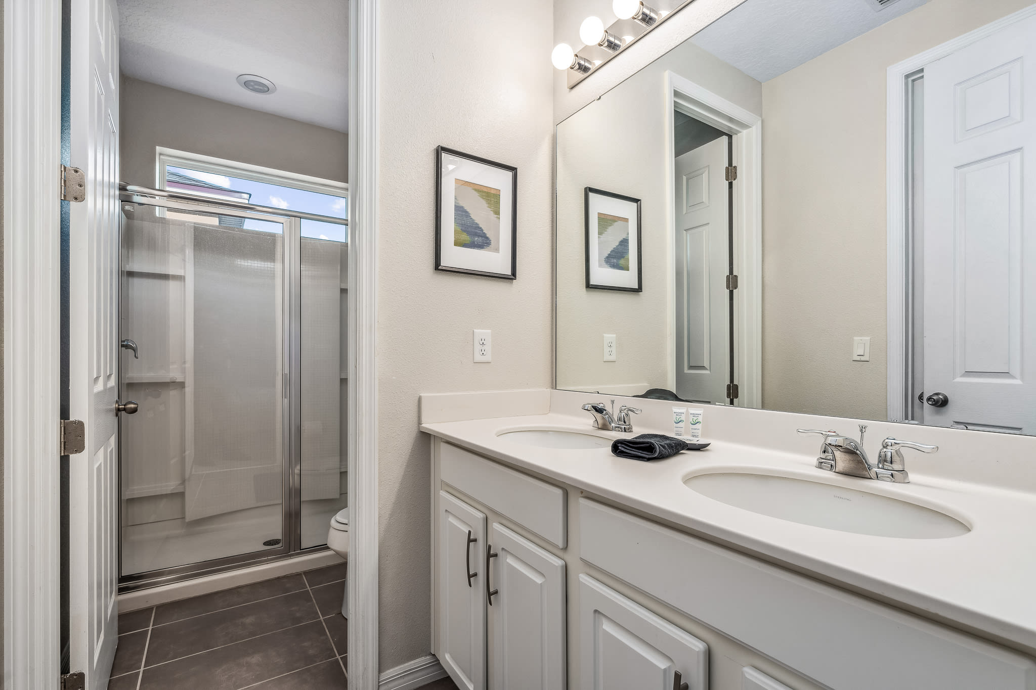 Bright bathroom vanity w/ sleek sink, mirror & crisp finishes for easy mornings.