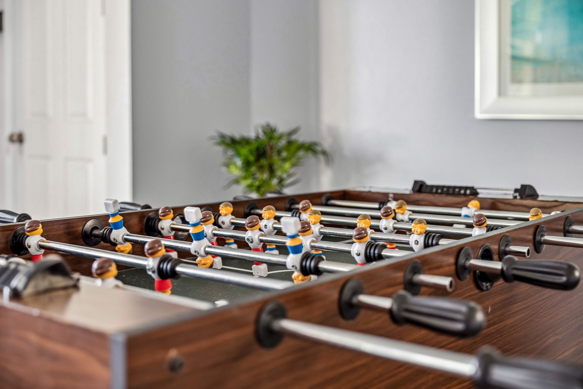 Game room foosball table ready for friendly matches and fun breaks.