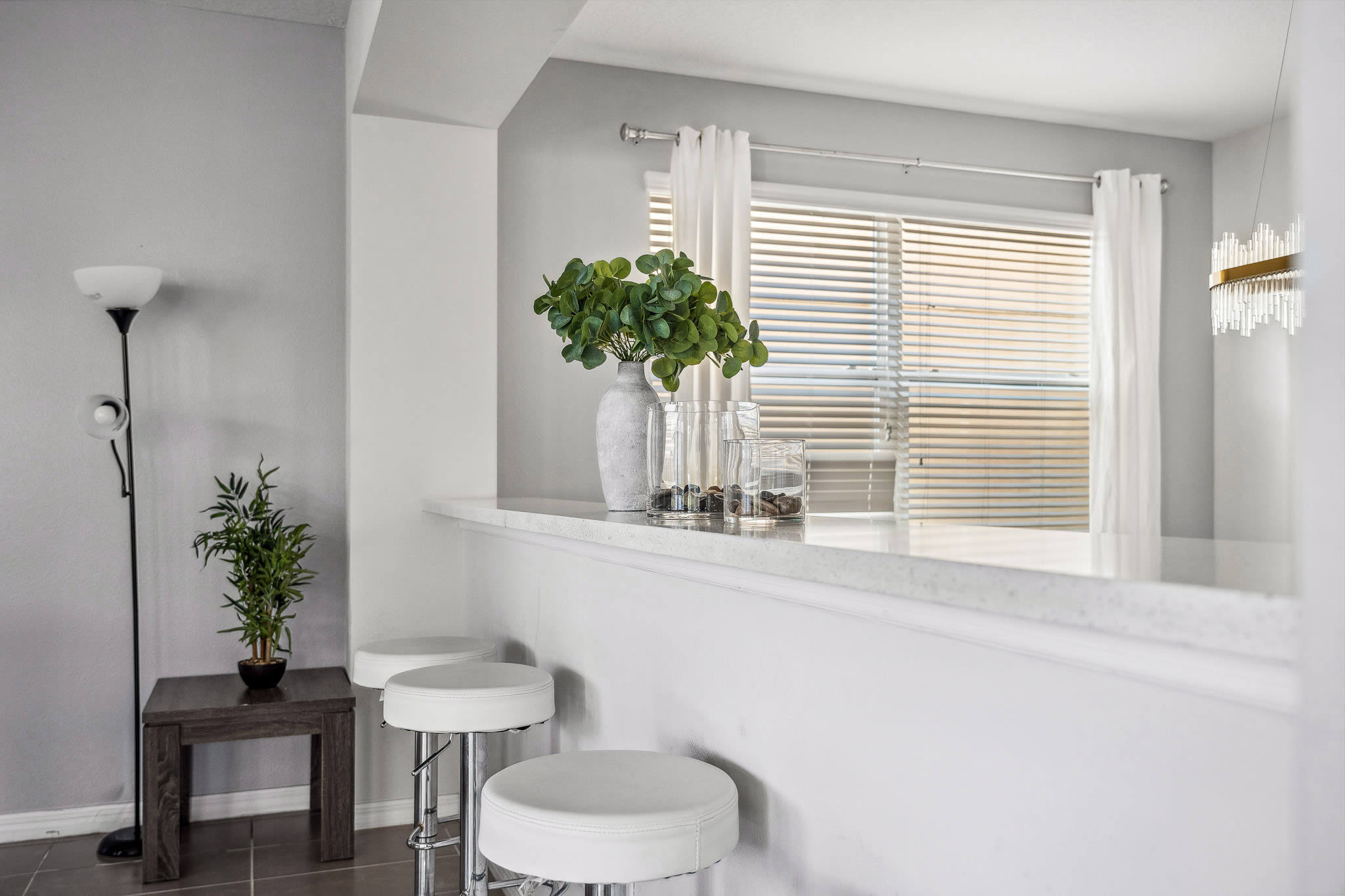 Bright dining area w/ a welcoming table, natural light & an open, airy vibe.
