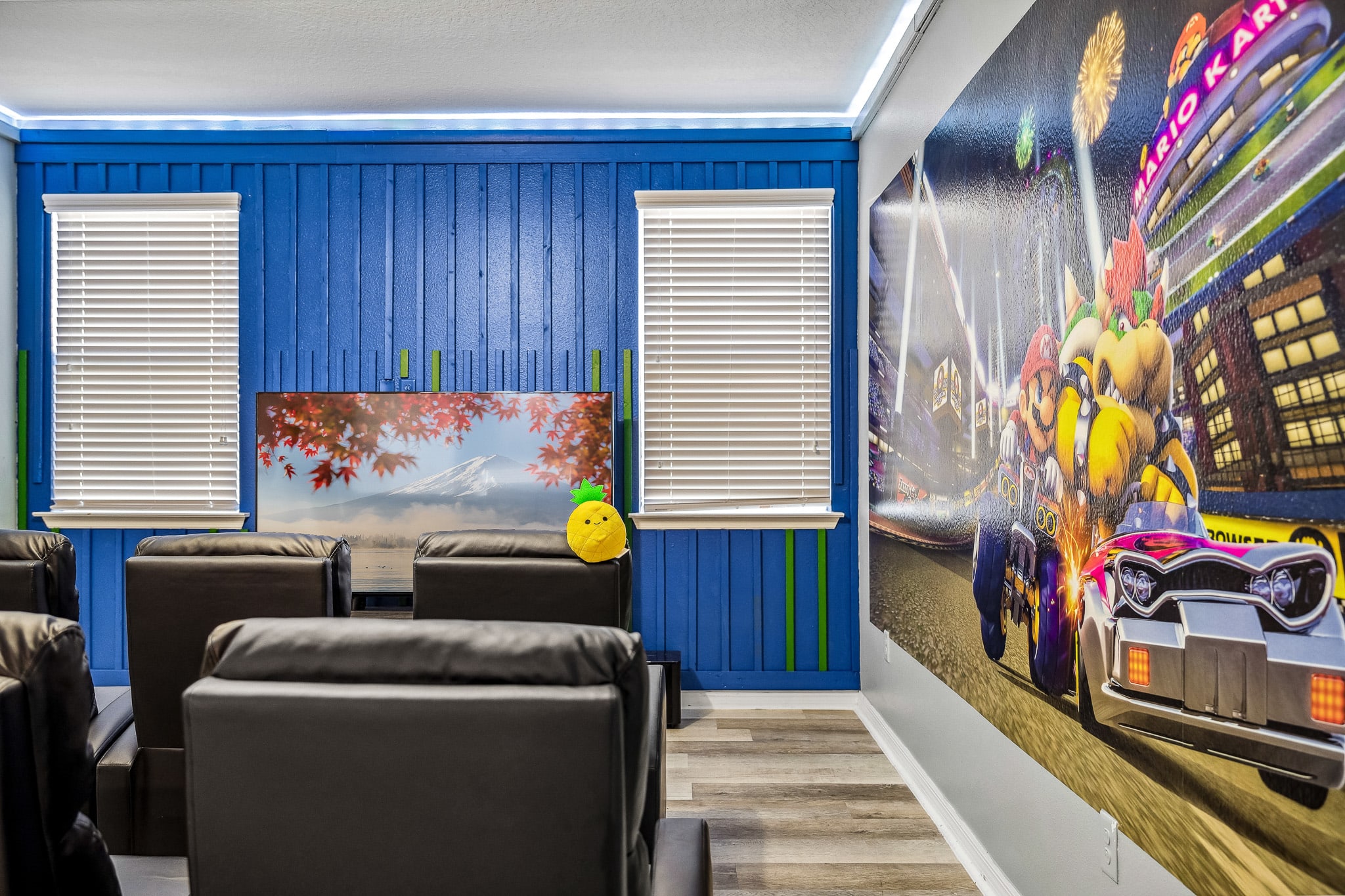 Vibrant game-themed room w/ colorful mural & an exciting, playful mood.