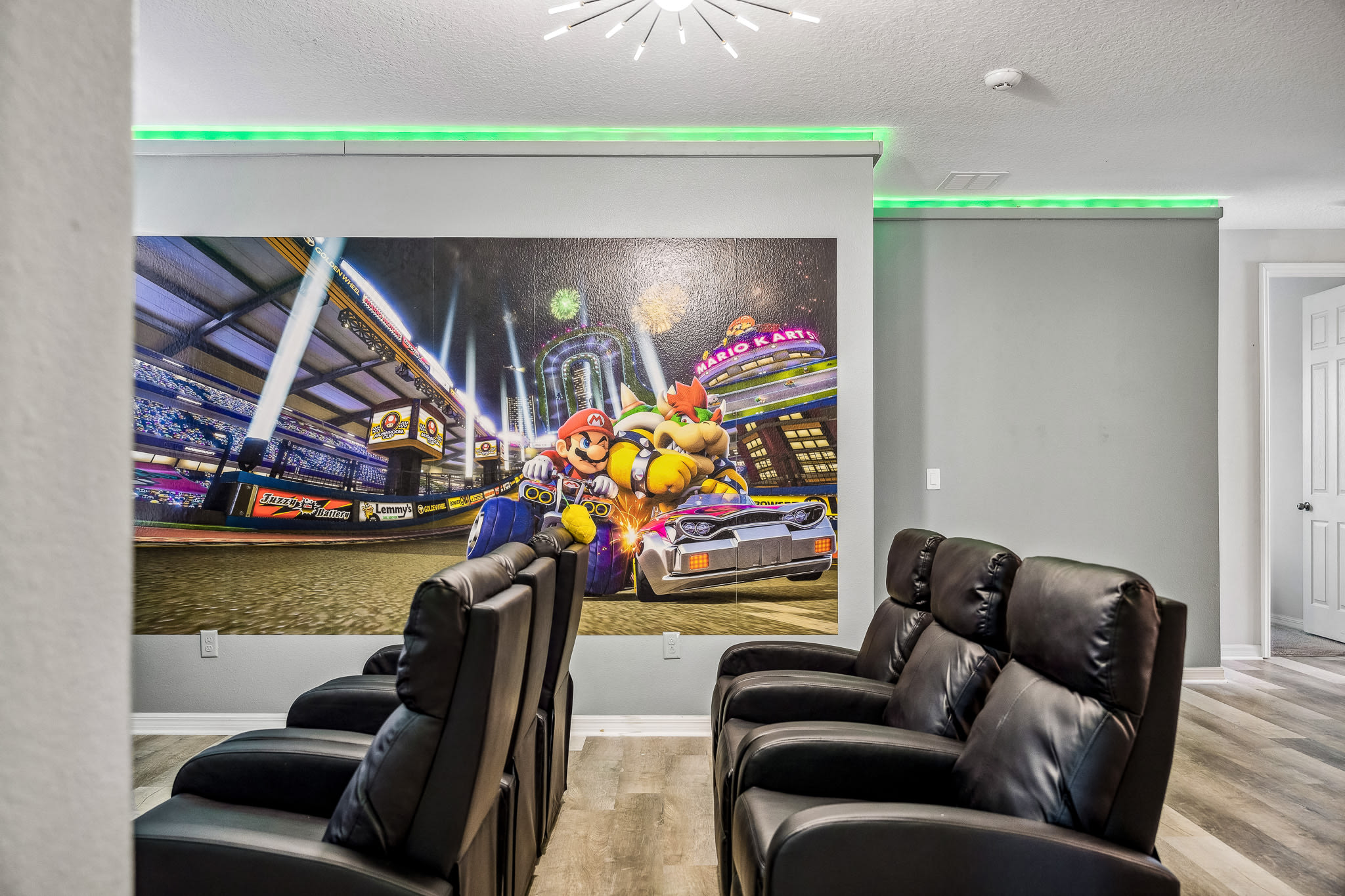 Cozy media room w/ plush seating, rich colors & a relaxed hangout vibe.