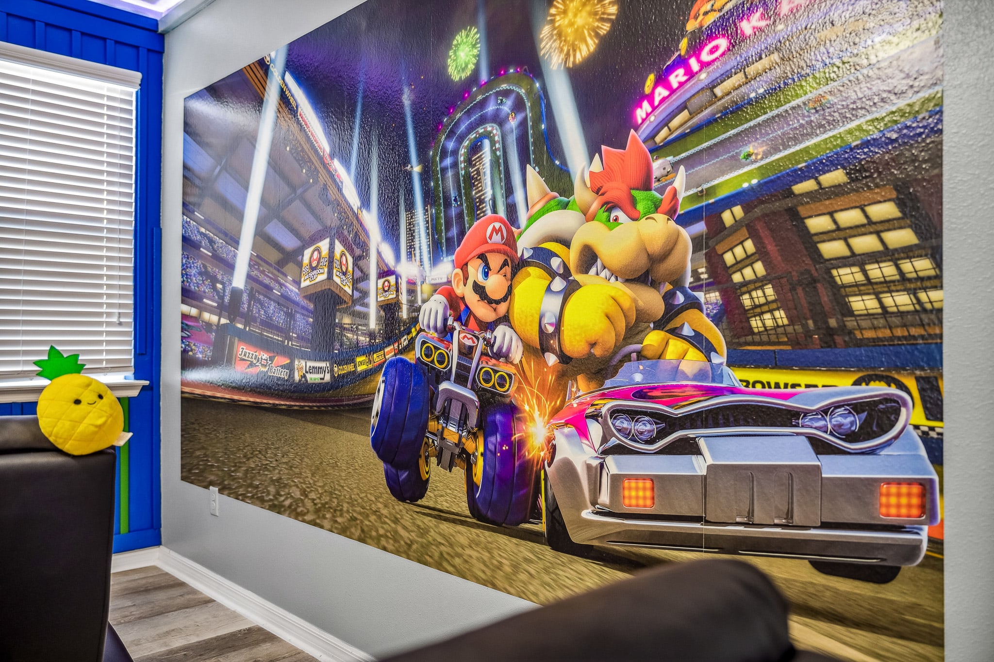 Gaming room setup w/ ergonomic chairs & an immersive, high-energy look.