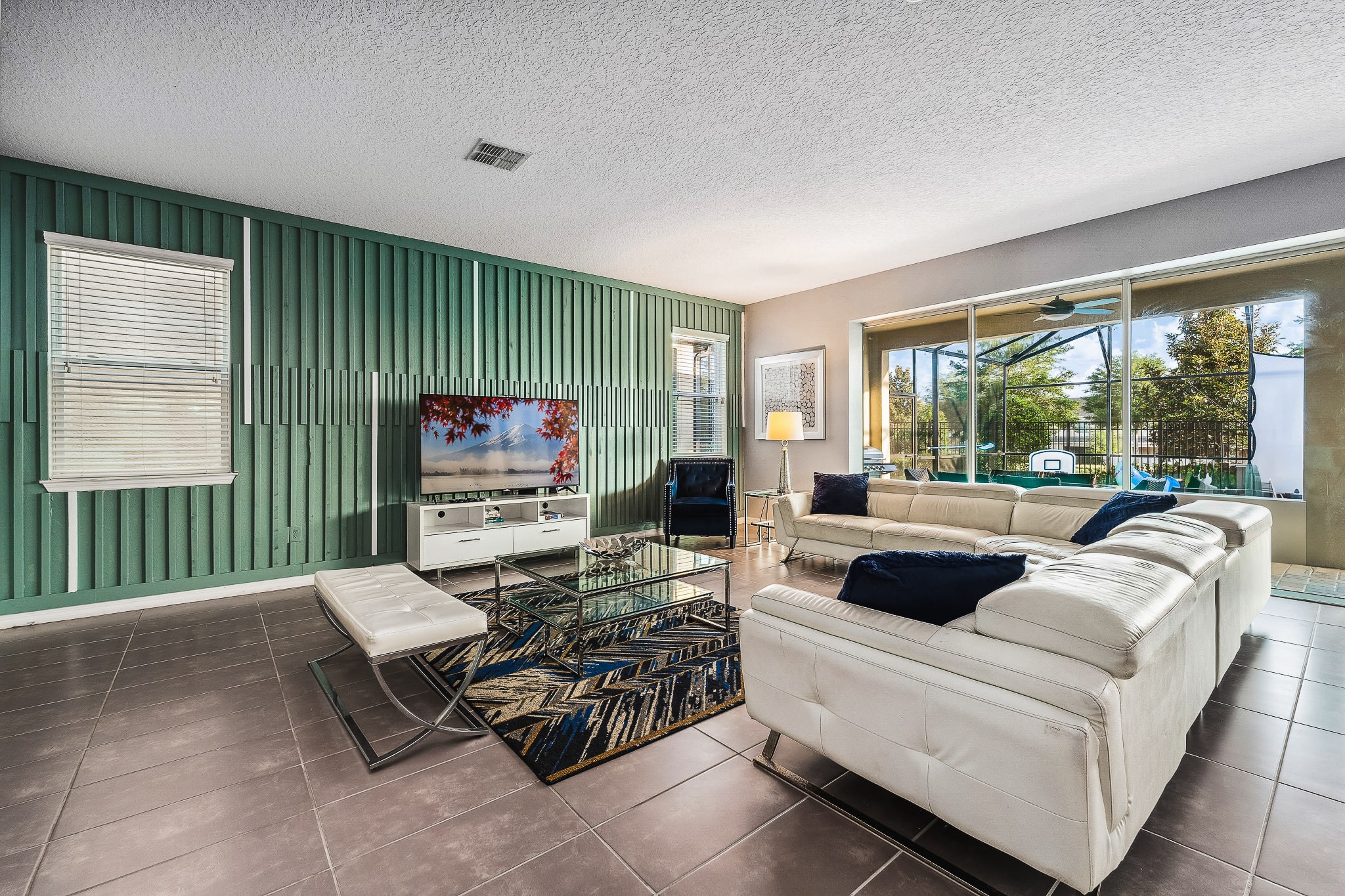 Stylish living room w/ comfy sofas and easy flow to the outdoors.
