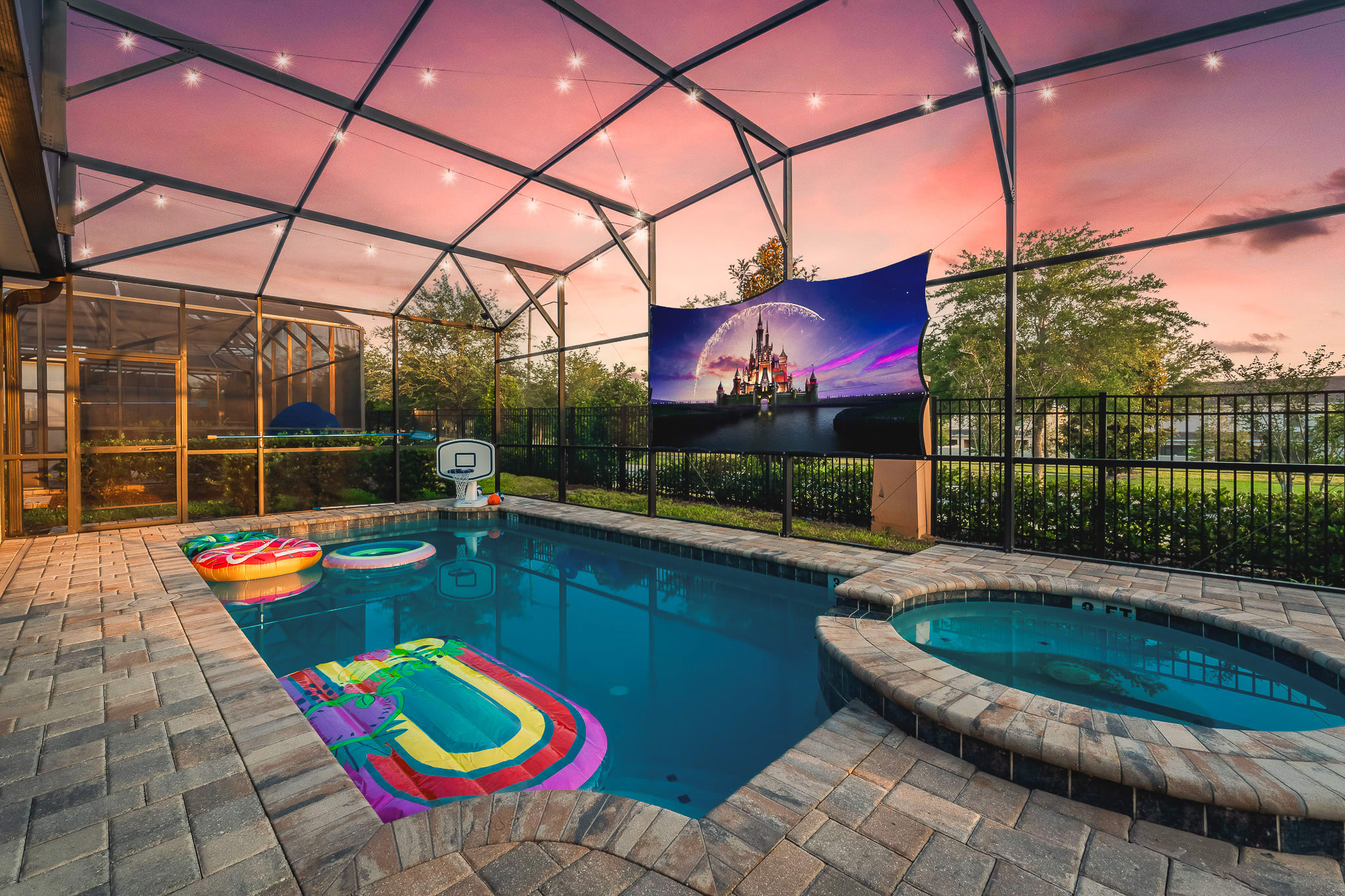 Spacious outdoor pool framed by palm trees, perfect for sunny afternoons.