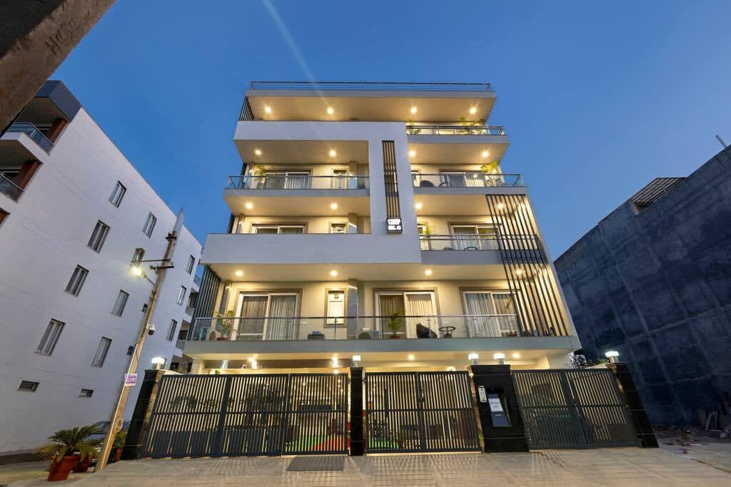 A panoramic view of the exterior of the building, showcasing its architectural design and surroundings -parfait street