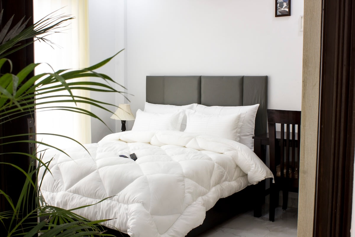 Unwind in Comfort: A bedroom outfitted with orthopedic mattresses to ensure a peaceful sleep.