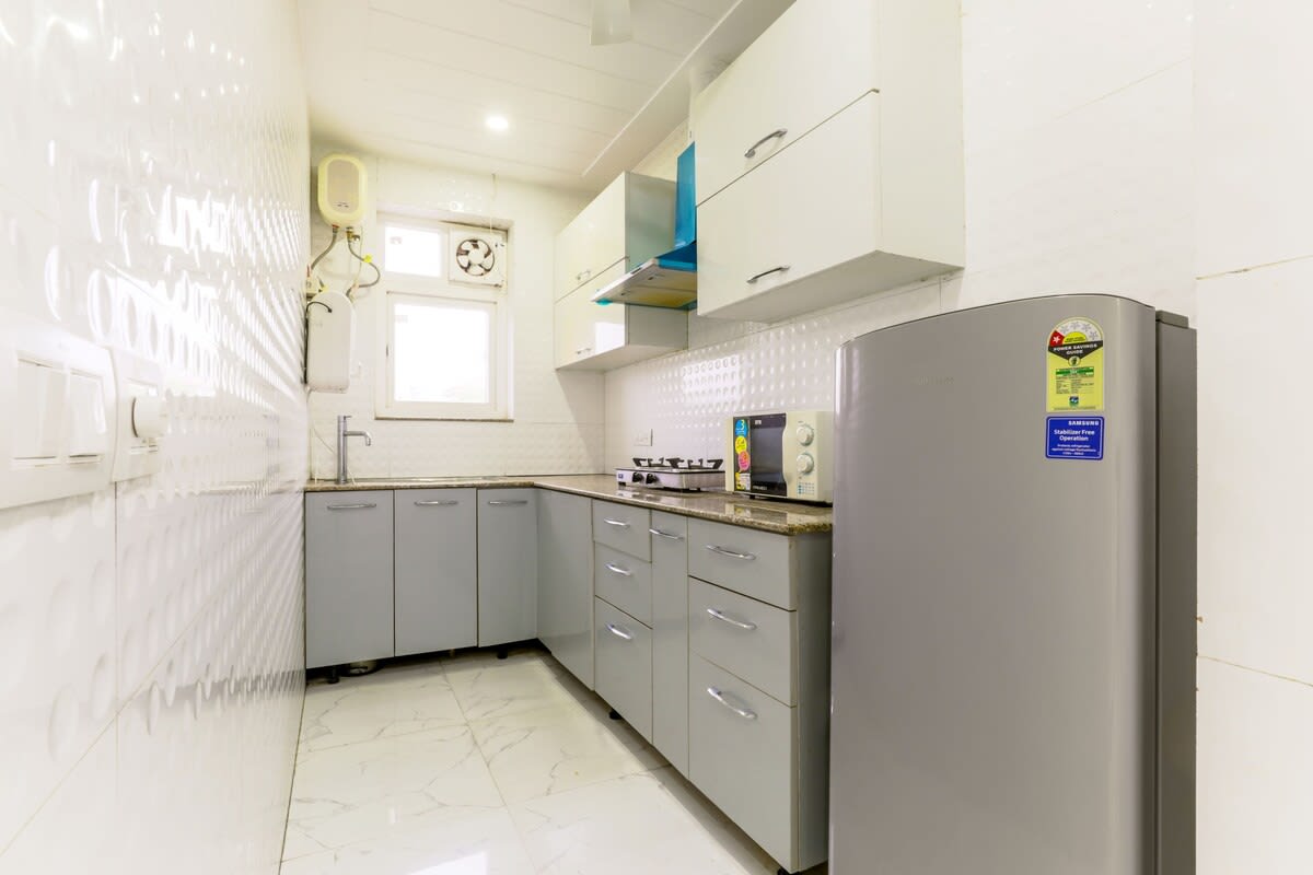 Stainless steel appliances, elegant worktops, and lots of storage make this modern kitchen perfect for cooking experiments and hosting visitors.
