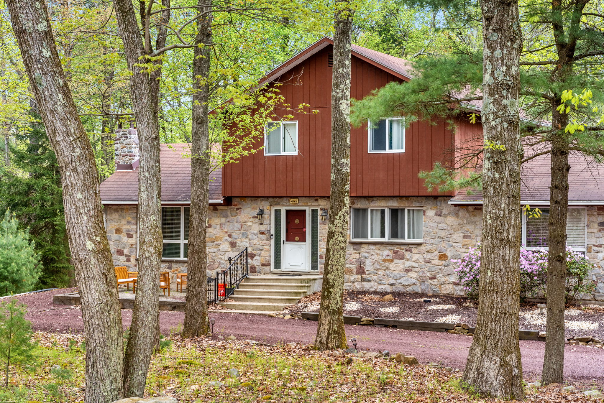 A beautiful two-story home nestled in a wooded setting, offering a perfect mix of seclusion and modern comfort.