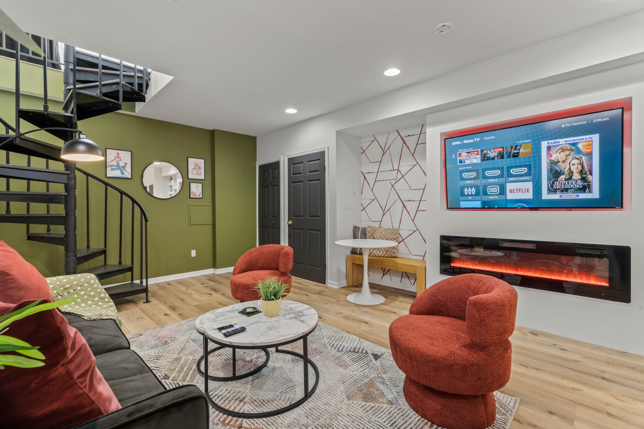 Experience modern living in this bright and airy space. The comfortable seating, contemporary fireplace, and stylish furnishings make this room a perfect spot to unwind and enjoy quality time.