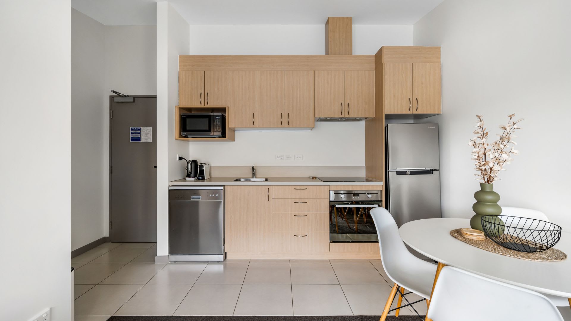 Bright, Functional Kitchen with Scenic Backdrop – Enjoy preparing meals in this stylish kitchen, featuring modern conveniences and large windows that provide natural light and breathtaking lake and mountain views.